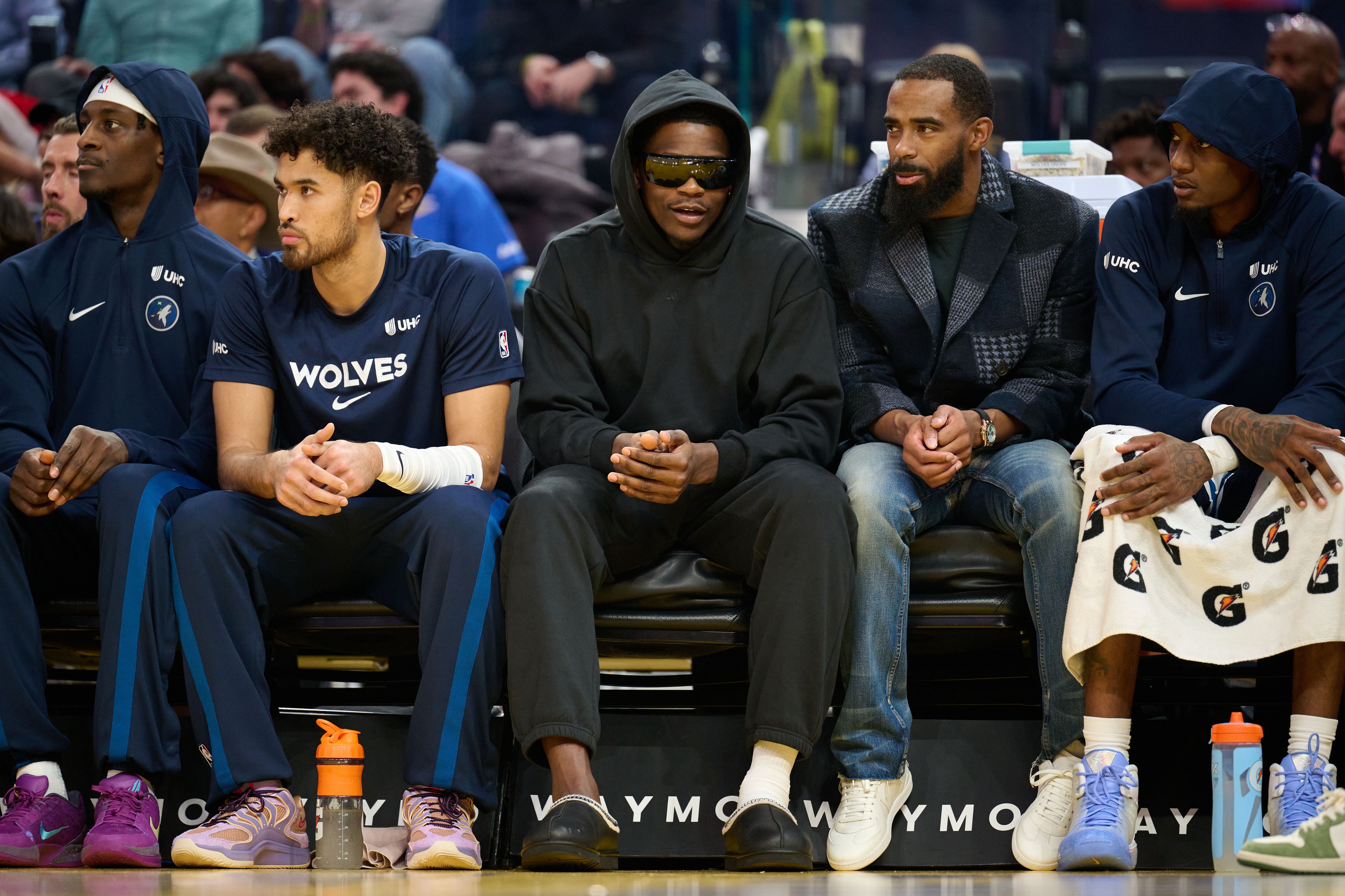 Minnesota Timberwolves guard Anthony Edwards (5), seen here watching a game in street clothes, plays a key role in our Thunder vs. Timberwolves prediction tonight.