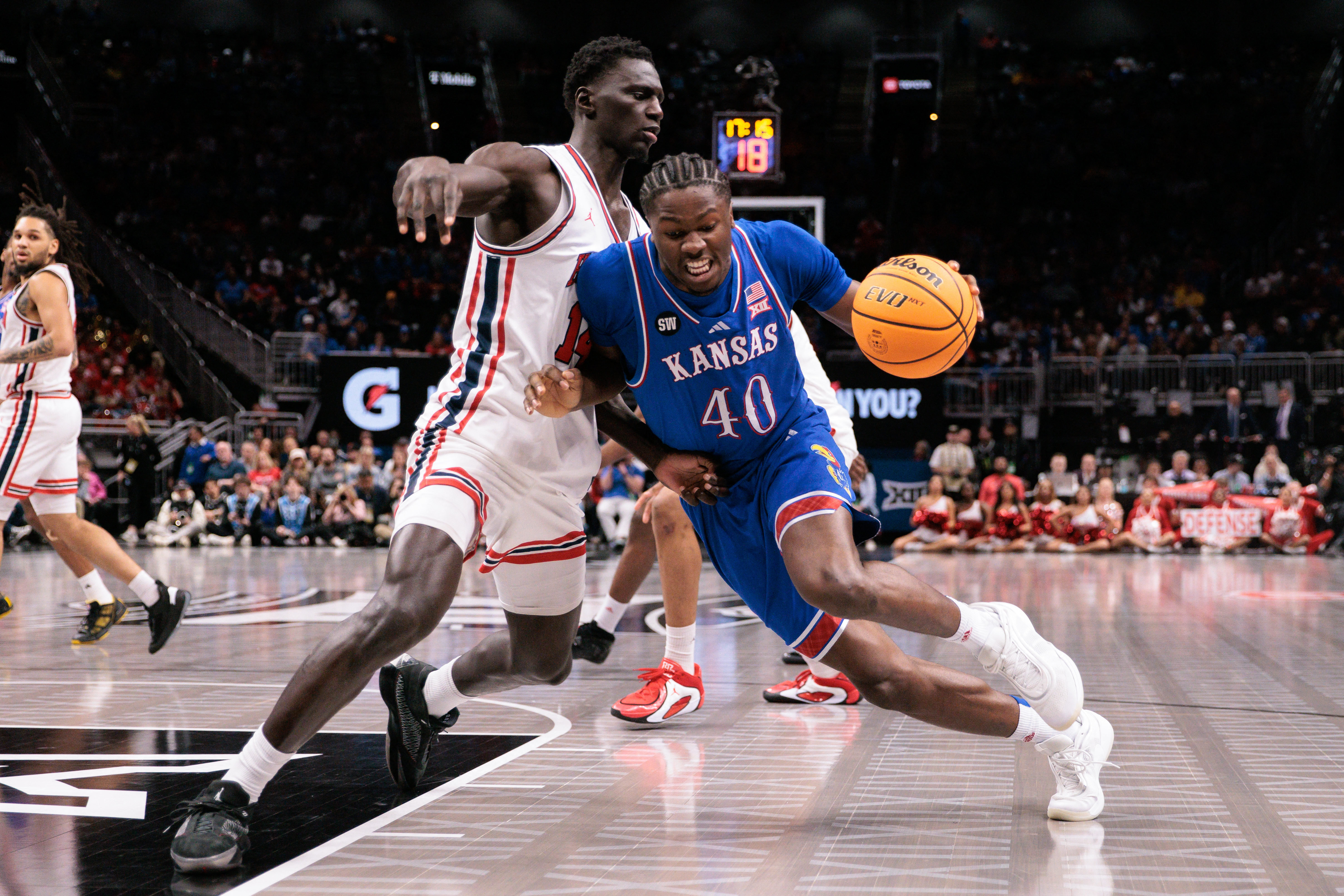 Kansas' Flory Bidunga (40) and Houston's Kalifa Sakho (14) are among the non-Americans highlighted in our breakdown of March Madness rosters by country and state. 