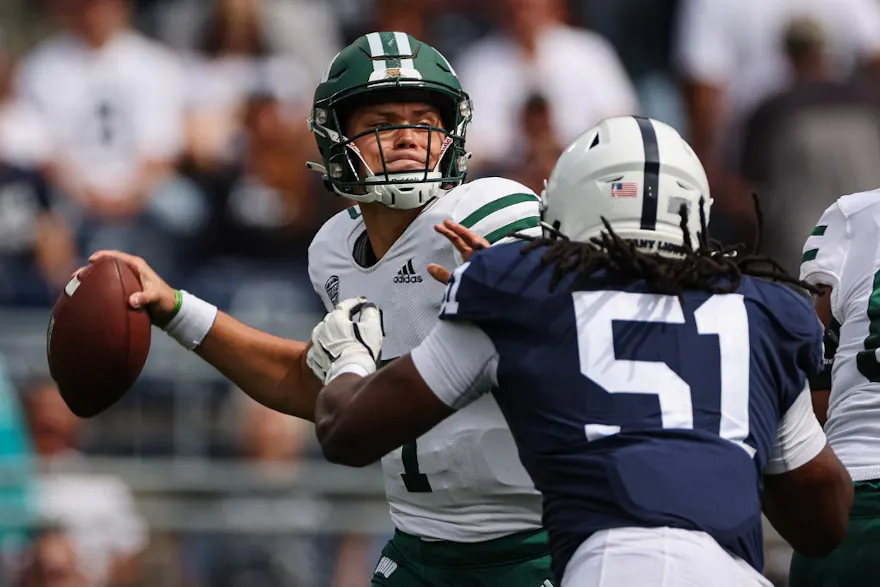 Kurtis Rourke of the Ohio Bobcats looks to pass as Hakeem Beamon of the Penn State Nittany Lions defends at Beaver Stadium on Sept. 10, 2022 in State College, Pennsylvania.