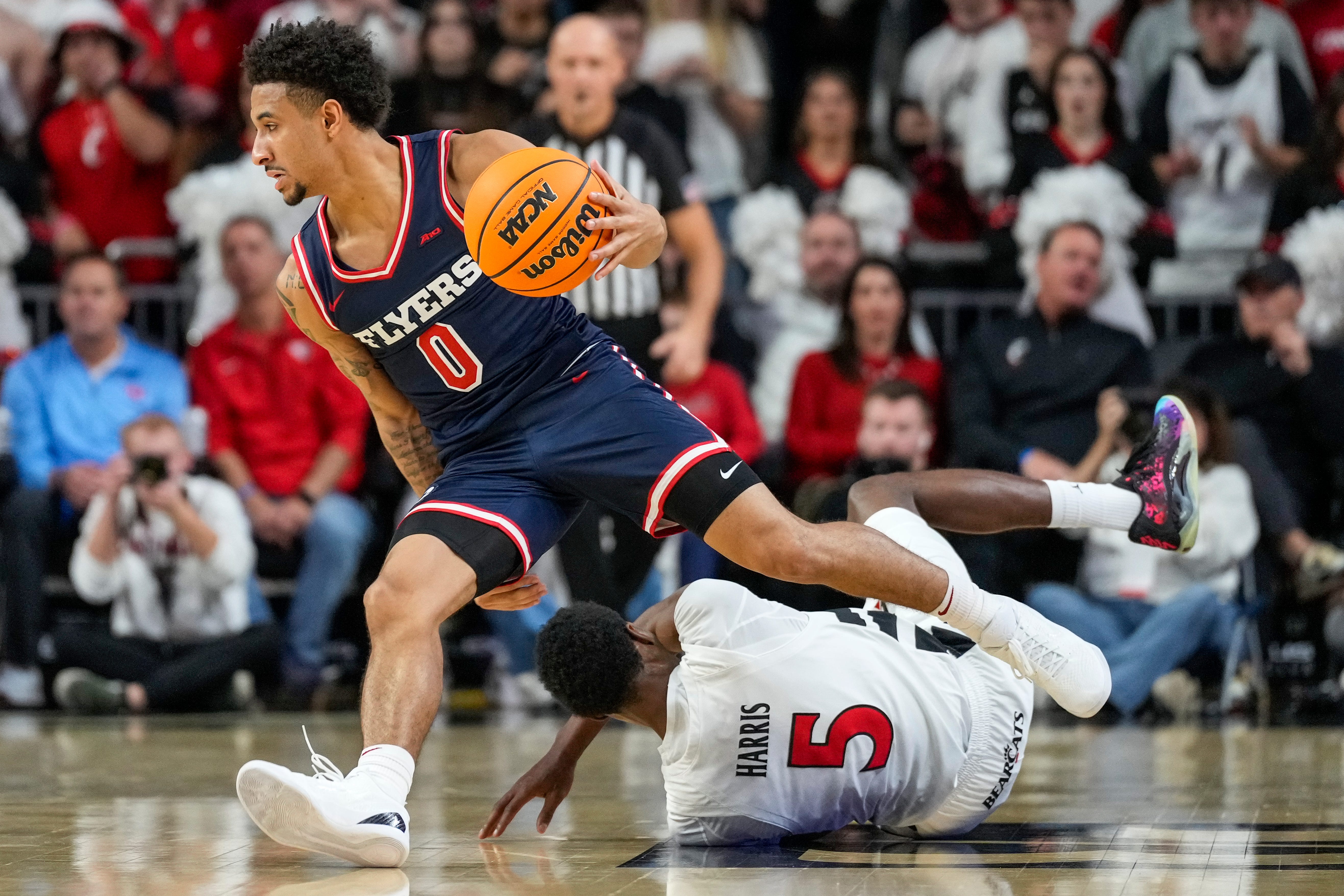 Dayton Flyers guard Javon Bennett (0) drives as part of our Dayton vs. Marquette prediction & odds