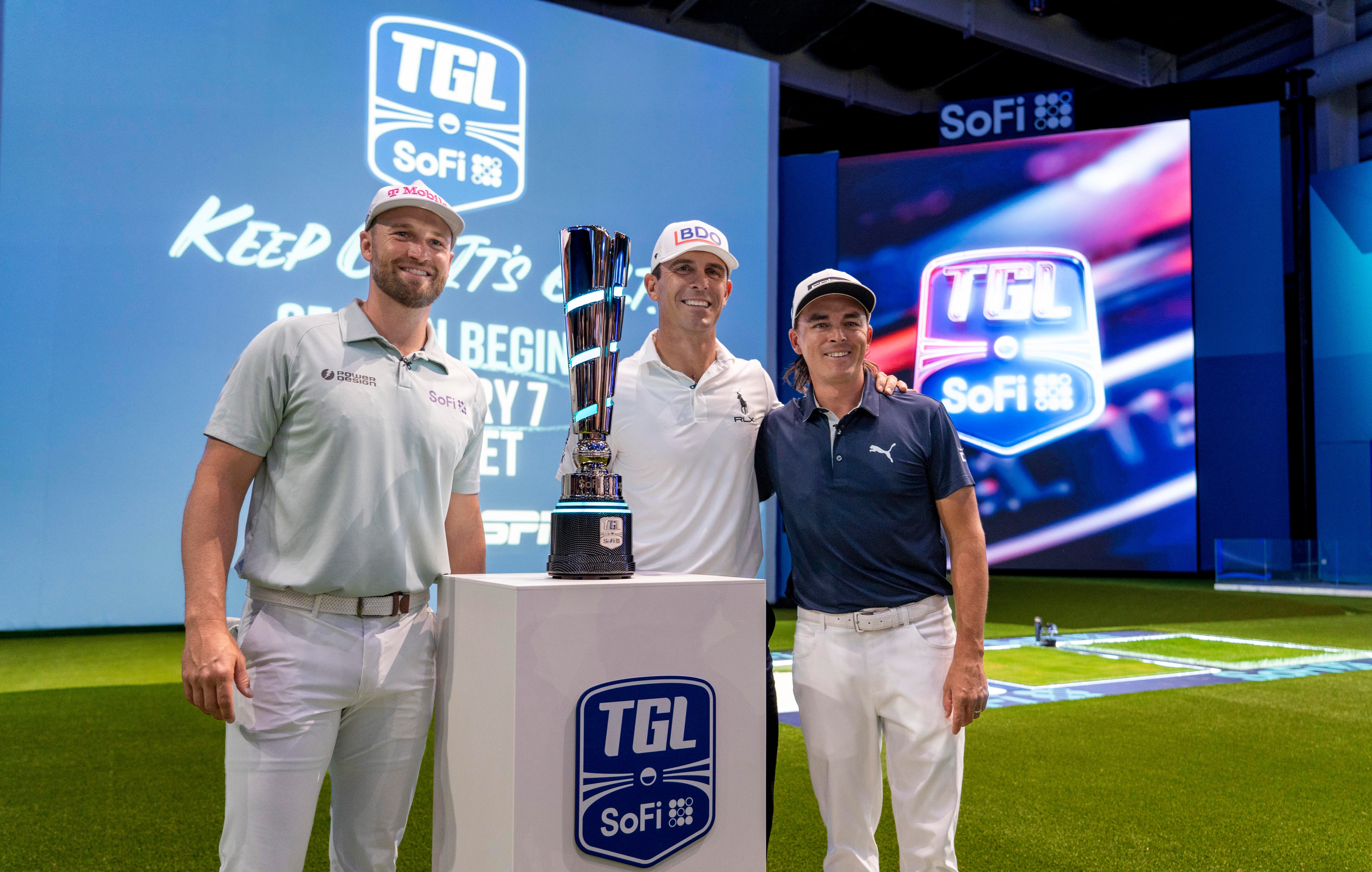 Golfers Wyndham Clark, left, Billy Horschel, center, and Rickie Fowler pose for a photo next to the TGL trophy as we look at our TGL odds and picks for Match 1.
