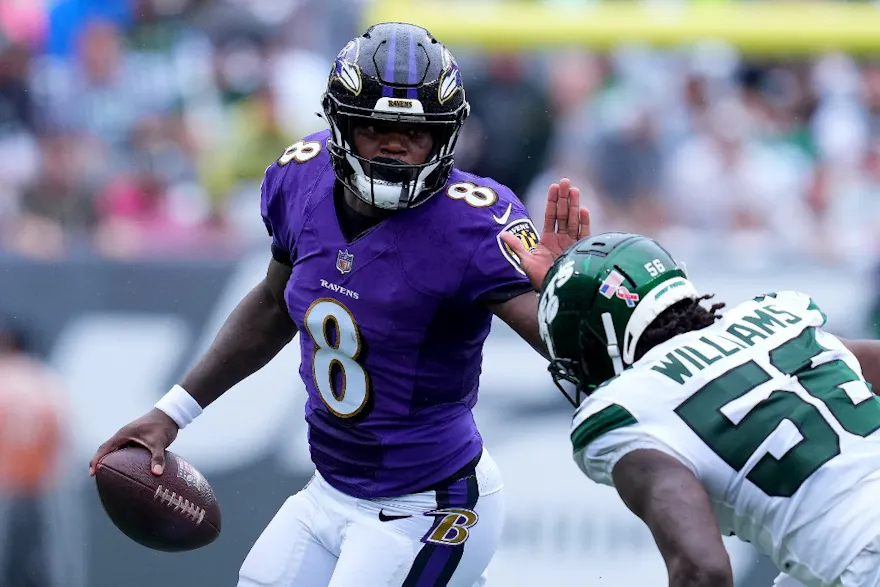 Lamar Jackson of the Baltimore Ravens scrambles against the New York Jets at MetLife Stadium.