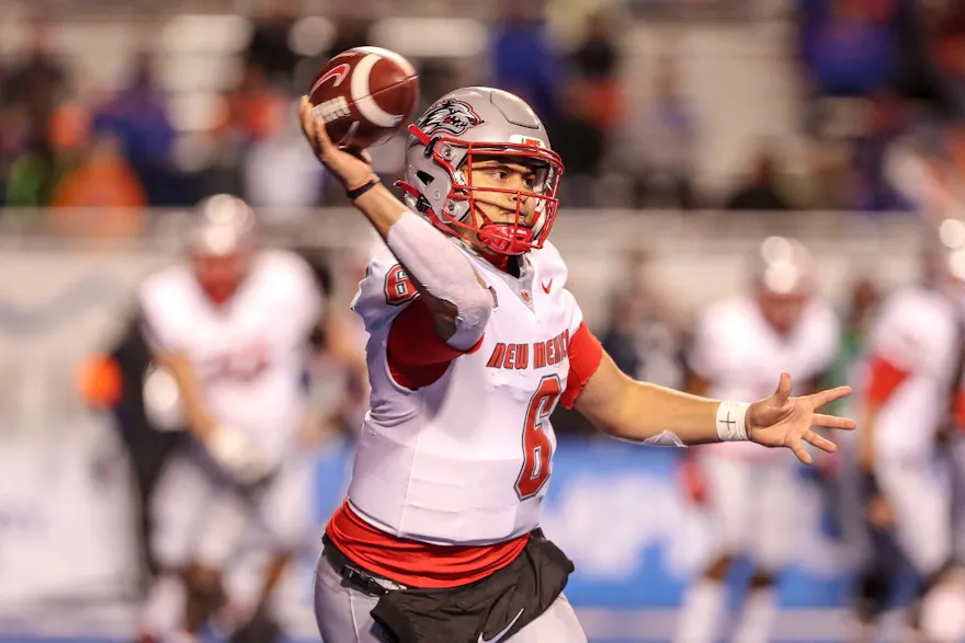 Quarterback Isaiah Chavez of the New Mexico Lobos passes the ball during first-half action against the Boise State Broncos. 