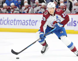 Nathan MacKinnon #29 of the Colorado Avalanche controls the puck against the Chicago Blackhawks as we make our player props and best bets for Tuesday's NHL action. 