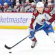 Nathan MacKinnon #29 of the Colorado Avalanche controls the puck against the Chicago Blackhawks as we make our player props and best bets for Tuesday's NHL action. 