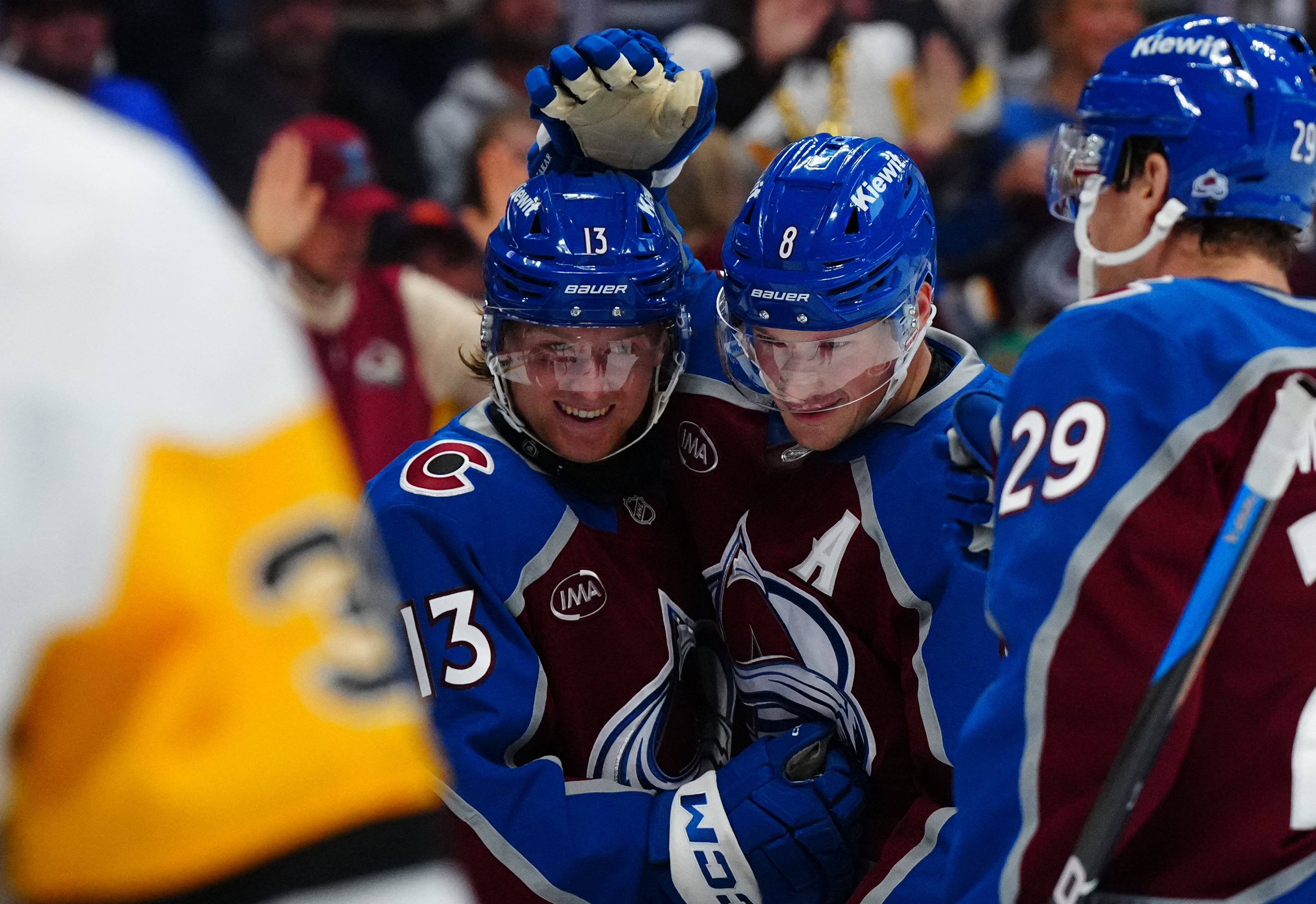 Colorado Avalanche right wing T.J. Hughes (13) celebrates his first NHL goal with defenseman Cale Makar (8) as we look at the Stanley Cup odds. 