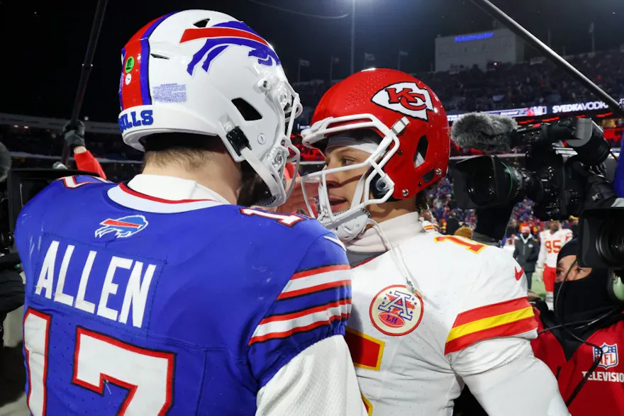 Patrick Mahomes #15 of the Kansas City Chiefs hugs Josh Allen #17 of the Buffalo Bills as we look at the 2024-25 NFL MVP odds and early favorites, contenders, and long shots ahead of the 2024 NFL season.