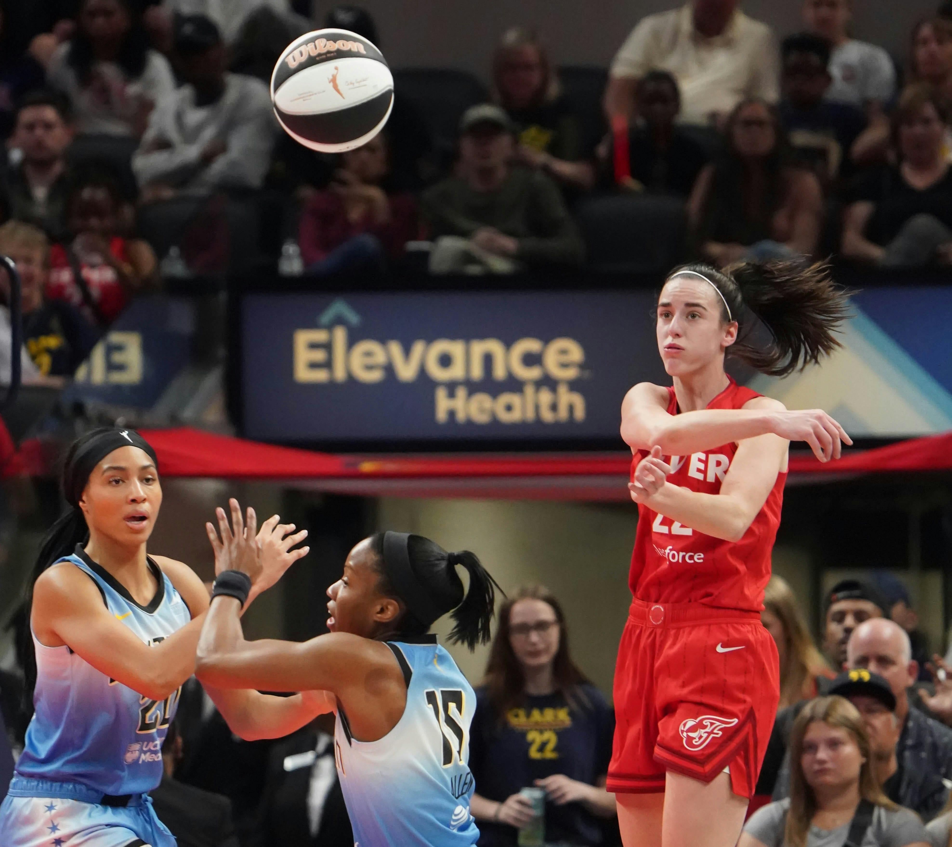 Indiana Fever guard Caitlin Clark (22) passes the ball during a game between the Indiana Fever and the Chicago Sky on June 1, 2024, at Gainbridge Fieldhouse in Indianapolis.<br>