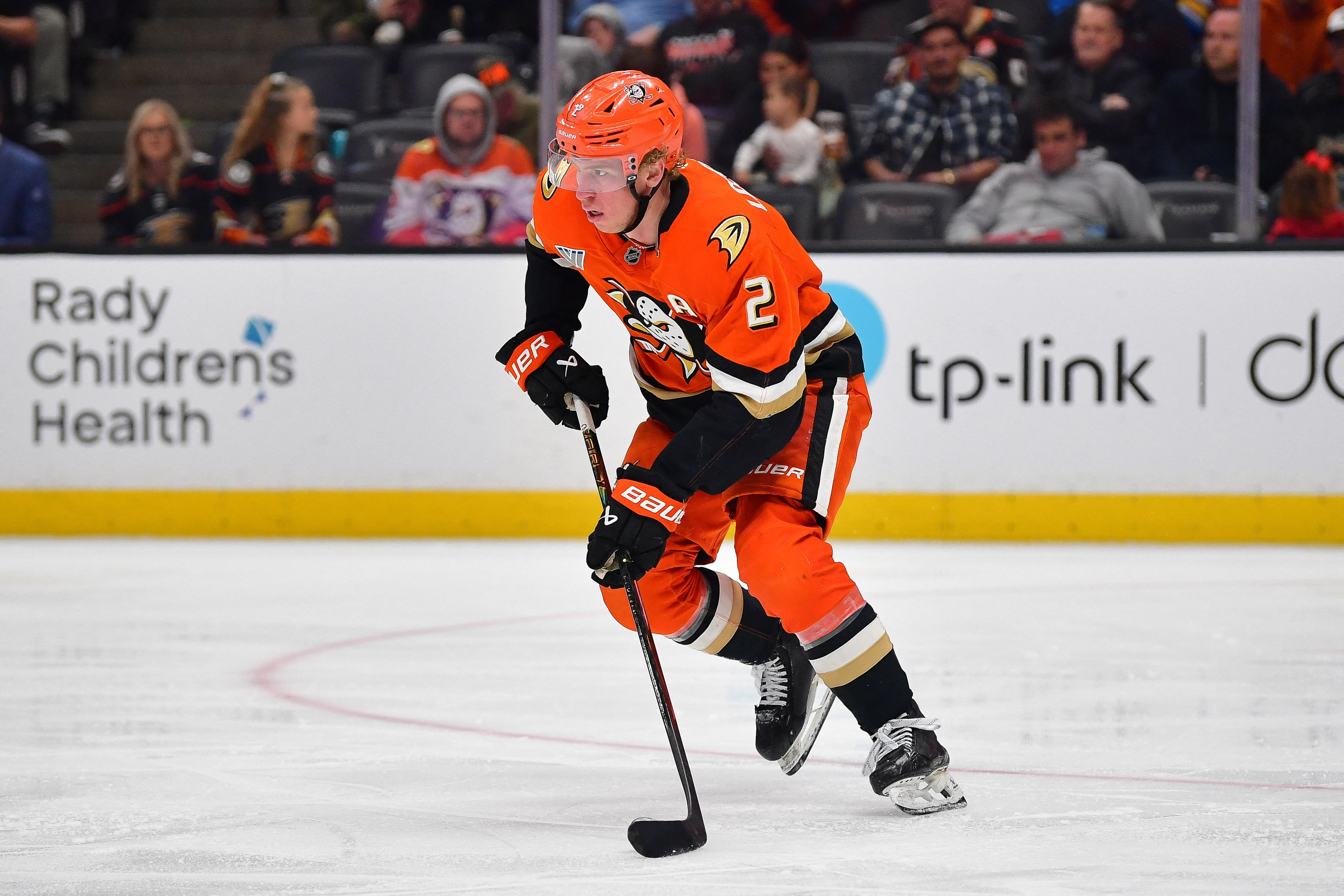 Anaheim Ducks defenseman Jackson LaCombe - who's featured in my Ducks vs. Golden Knights prediction - moves the puck. 