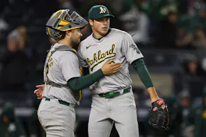 Mason Miller and Shea Langeliers of the Oakland Athletics celebrate a win over the New York Yankees, and we're examining Mason Miller's AL Rookie of the Year eligibility with a look at the best MLB odds.
