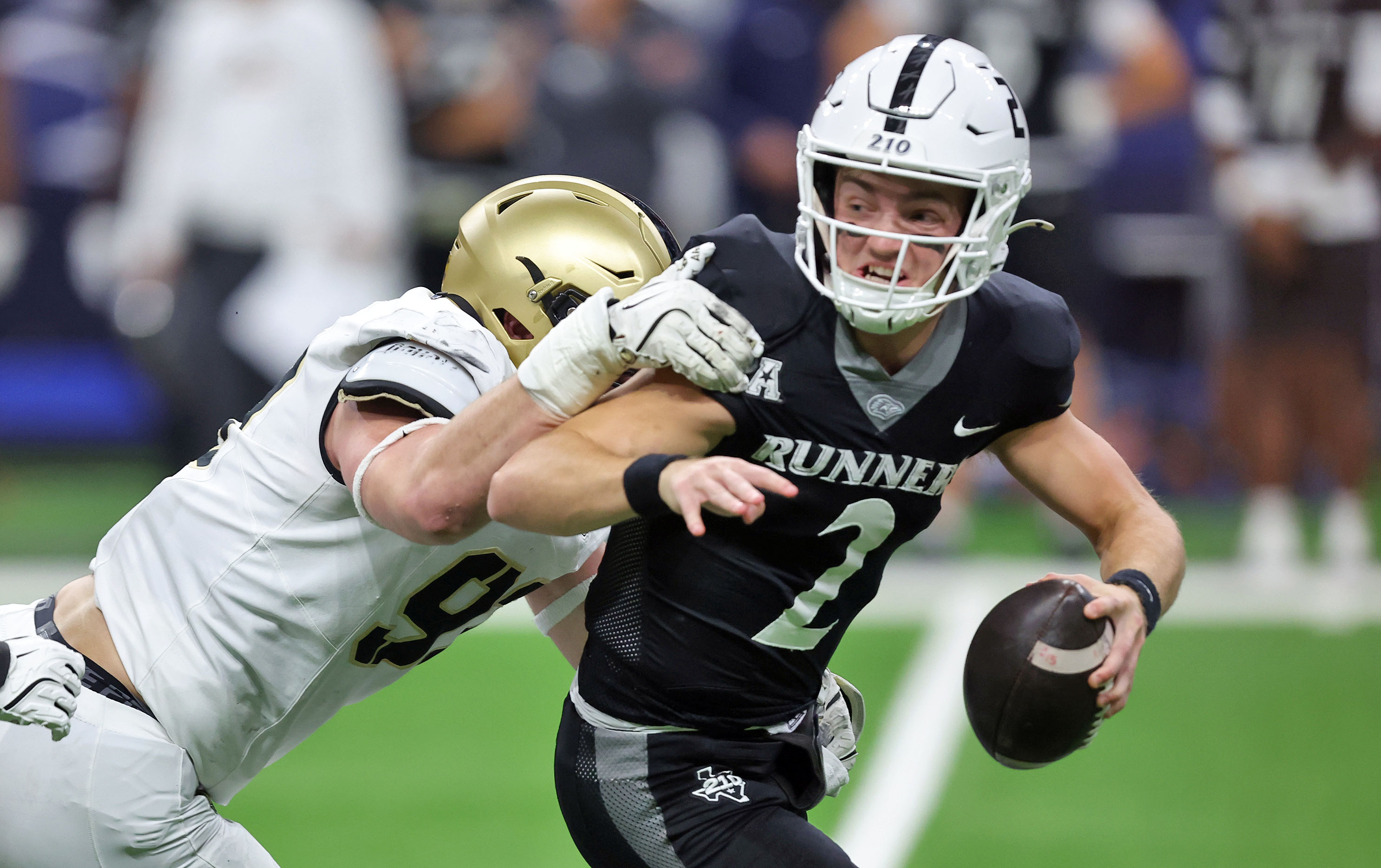 UTSA Roadrunners quarterback Owen McCown (2), seen here trying to evade pressure, is featured in our FIU vs. UTSA predictions and odds for the 2025 First Responder Bowl.