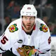 Jarred Tinordi #25 of the Chicago Blackhawks skates as we look at Illinois' sportsbook financials for February 2024.