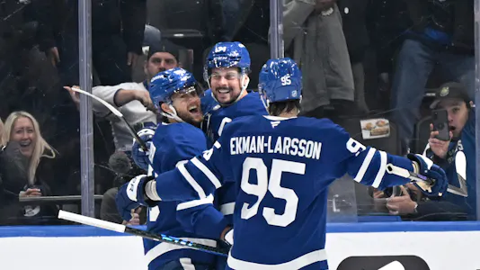 Toronto Maple Leafs forward Auston Matthews (34) celebrates a goal with teammates, and he is projected to score again in our NHL player prop bets tonight.