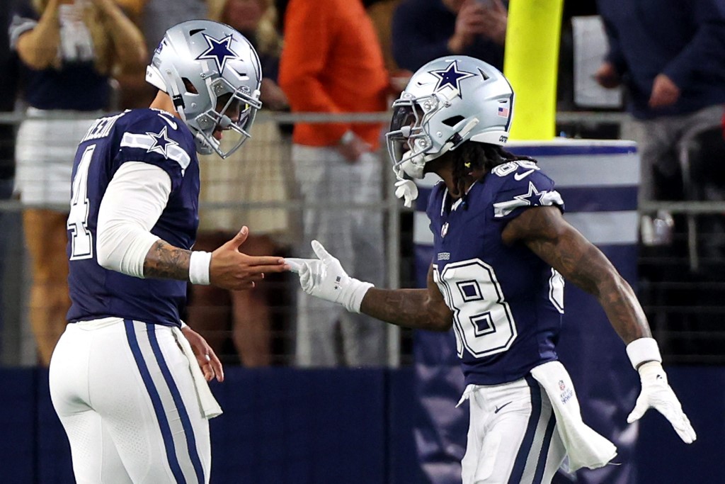 CeeDee Lamb #88 of the Dallas Cowboys celebrates with Dak Prescott #4 after scoring a 92 yard touchdown as we make our Packers vs. Cowboys prediction and pick ahead of Sunday's playoff game on NFL Wild Card Weekend.
