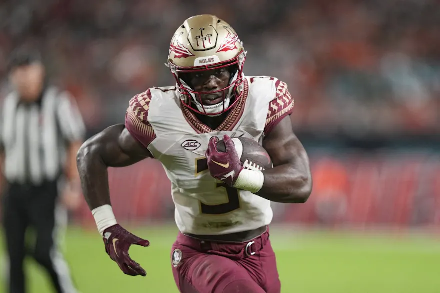 MIAMI GARDENS, FL - NOVEMBER 05: Trey Benson #3 of the Florida State Seminoles rushes for a touchdown during the second quarter against the Miami Hurricanes at Hard Rock Stadium on November 5, 2022 in Miami Gardens, Florida.   