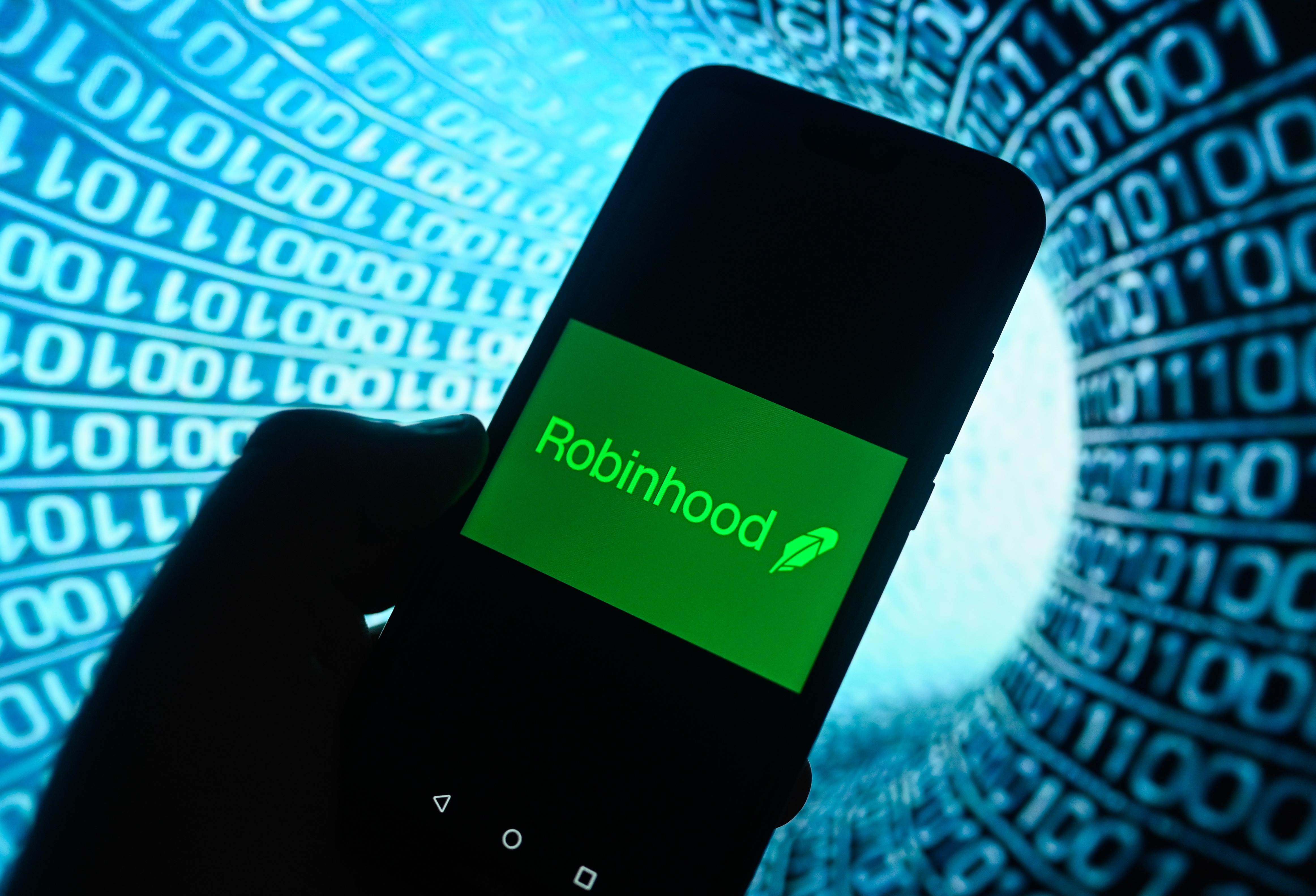 A RobinHood logo is displayed on a smartphone as we look at its partnership to enter the prediction market space.