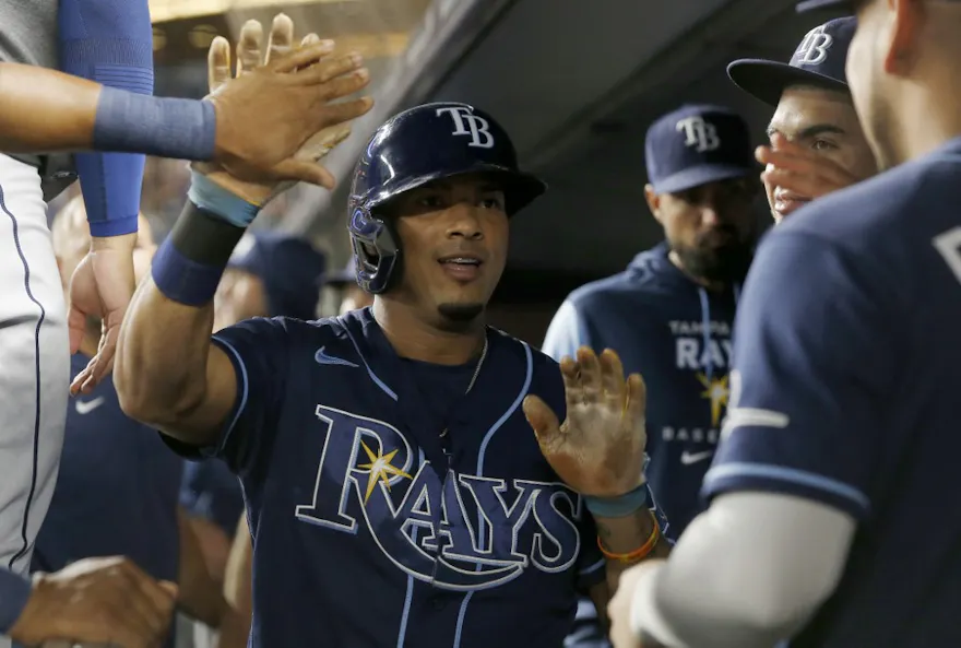 Wander Franco #5 of the Tampa Bay Rays celebrates with his teammates in the dugout after scoring a run during the first inning against the New York Yankees at Yankee Stadium on Sept. 9.