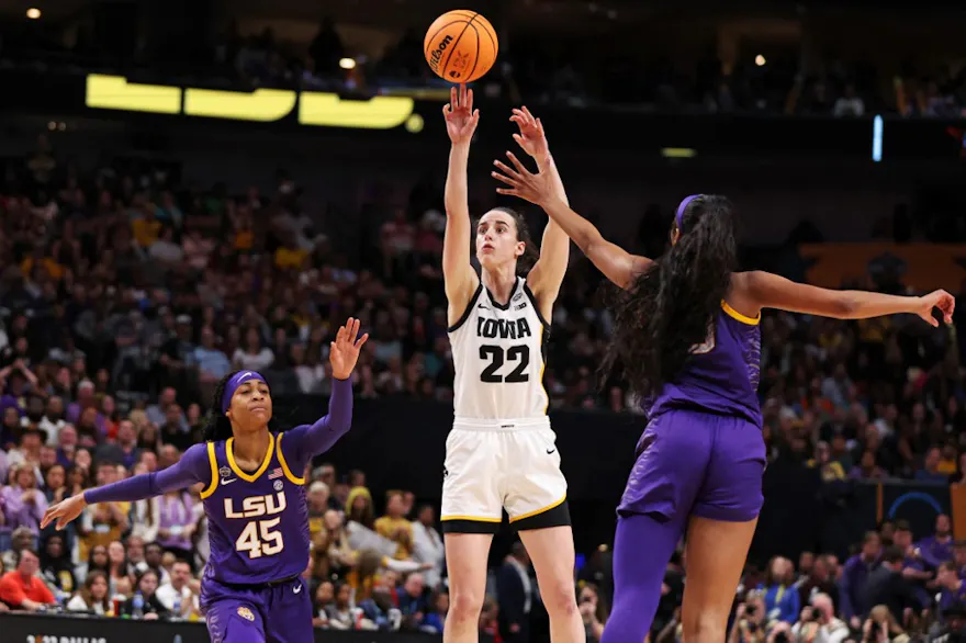 Caitlin Clark of the Iowa Hawkeyes shoots the ball against Angel Reese  of the LSU Lady Tigers during the 2023 NCAA Women's Basketball Tournament final. The Hawkeyes and Tigers play a rematch as we offer our Caitlin Clark player props for LSU vs. Iowa.