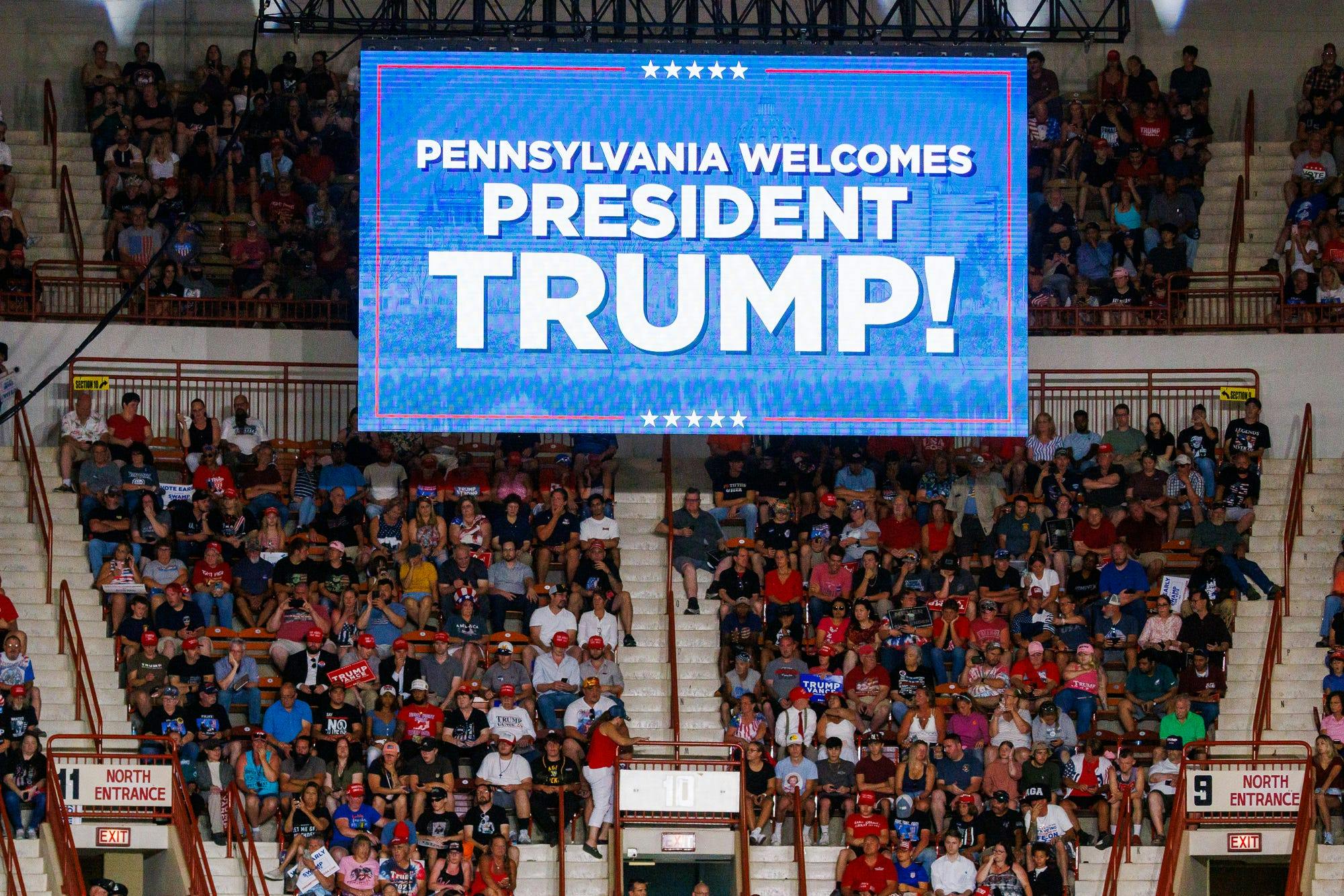 Supporters await former president Donald Trump during a rally at the New Holland Arena in Harrisburg, Pa.