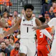 Jayden Gardner #1 of the Virginia Cavaliers is congratulated by teammates after scoring a basket and drawing a foul against the Illinois Fighting Illini in the first half of the championship game of the Continental Tire Main Event basketball tournament at