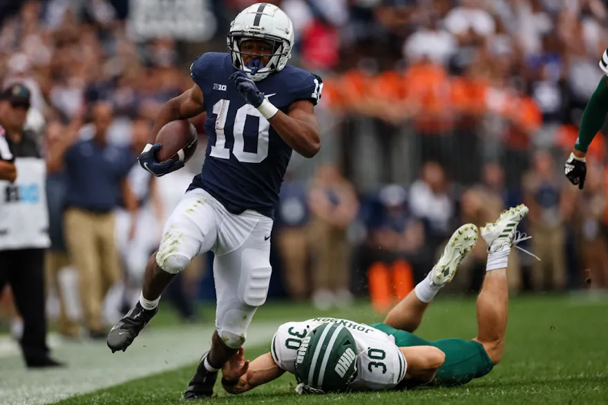 Penn State Nittany Lions running back Nicholas Singleton avoids the attempted tackle of Ben Johnson of the Ohio Bobcats to score a touchdown during the second half at Beaver Stadium on September 10, 2022 in State College, Pennsylvania.