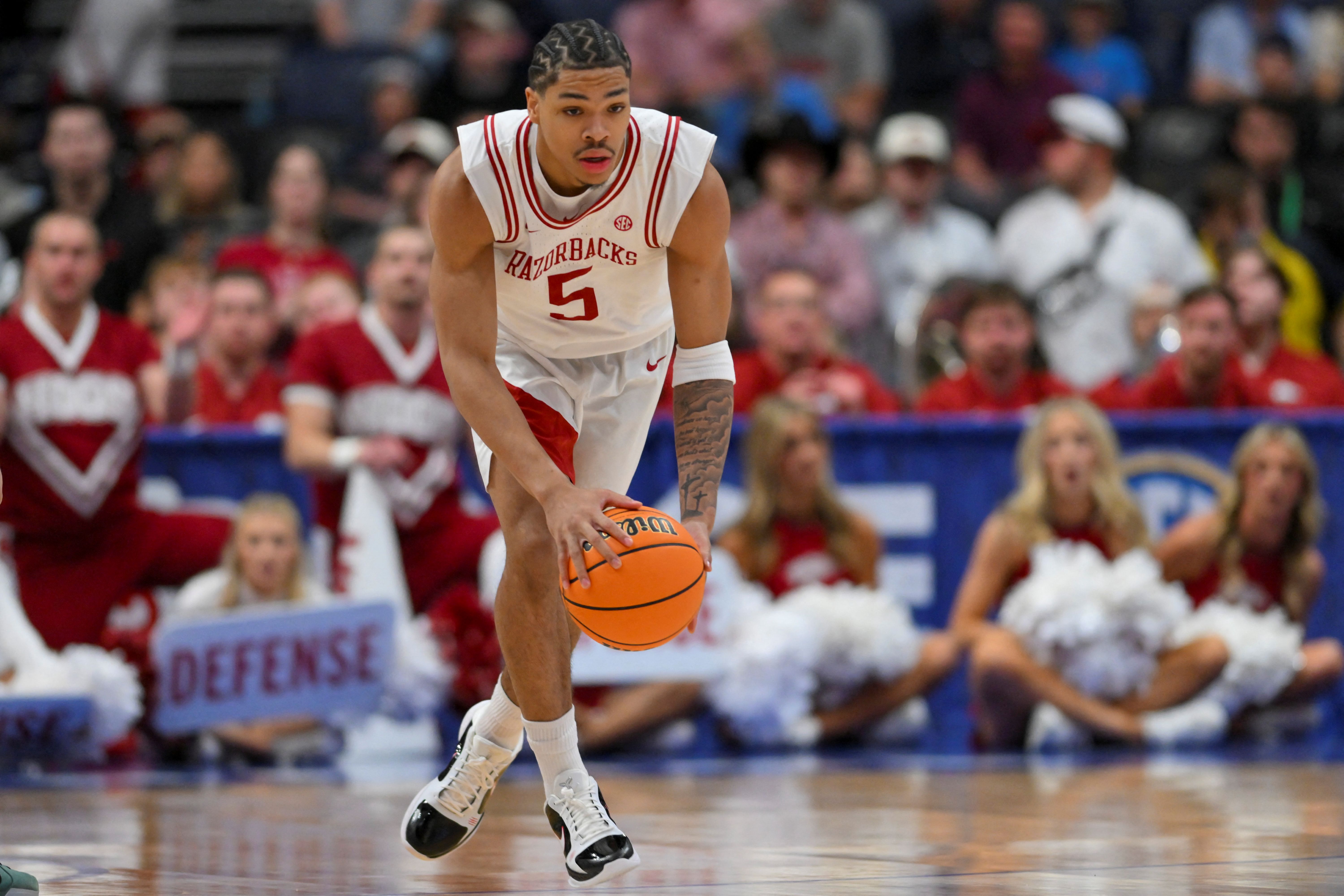 Arkansas Razorbacks guard Darius Acuff Jr. brings the ball up court as we make our best Hawaii vs. Arkansas prediction.