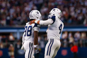 Dallas Cowboys wide receiver Ceedee Lamb (88) celebrates with Dallas Cowboys quarterback Dak Prescott (4) as we offer our NFL AI predictions for Week 9.