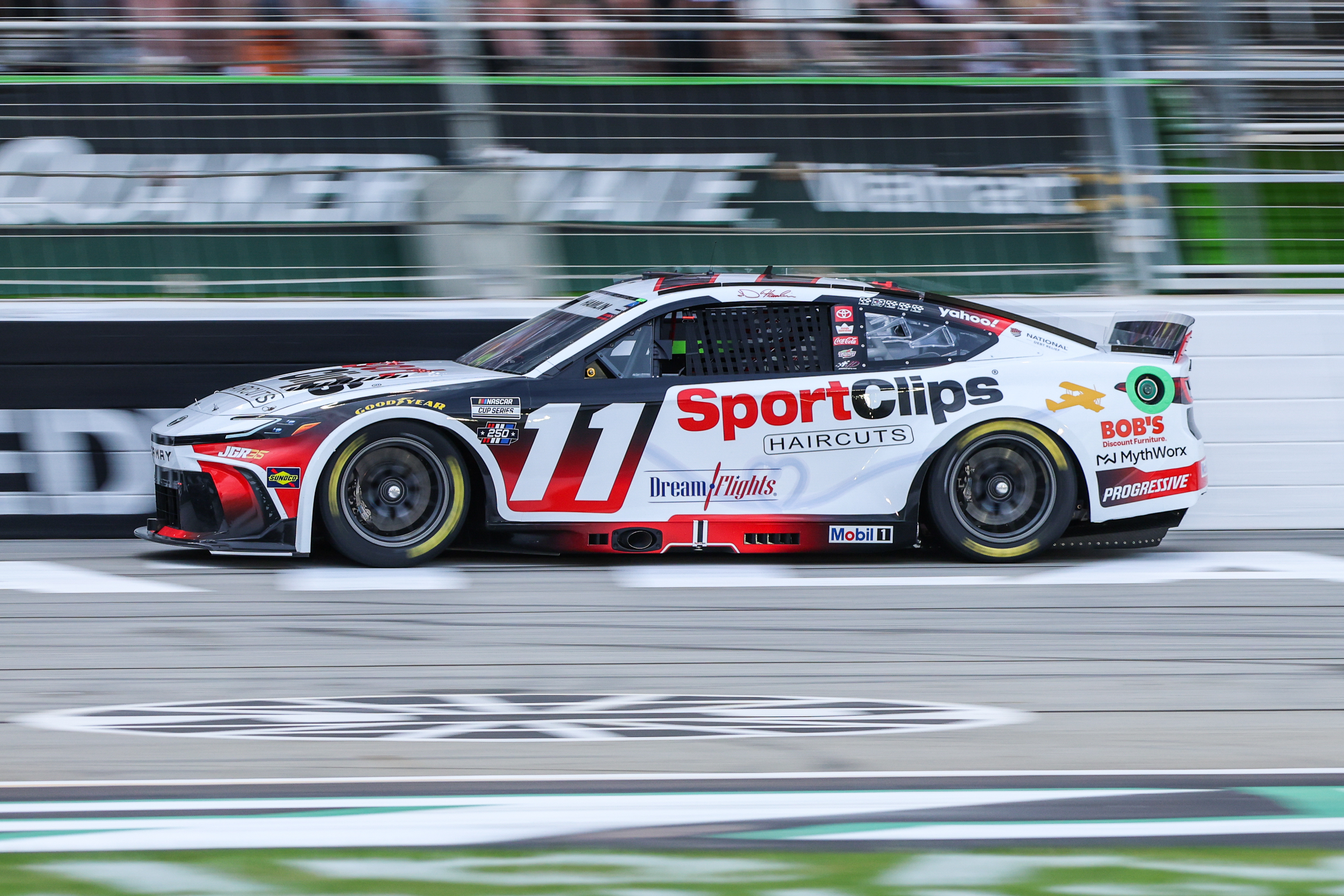 Sport Clips Haircuts driver Denny Hamlin (11) races as we break down our NASCAR predictions at North Wilkesboro.