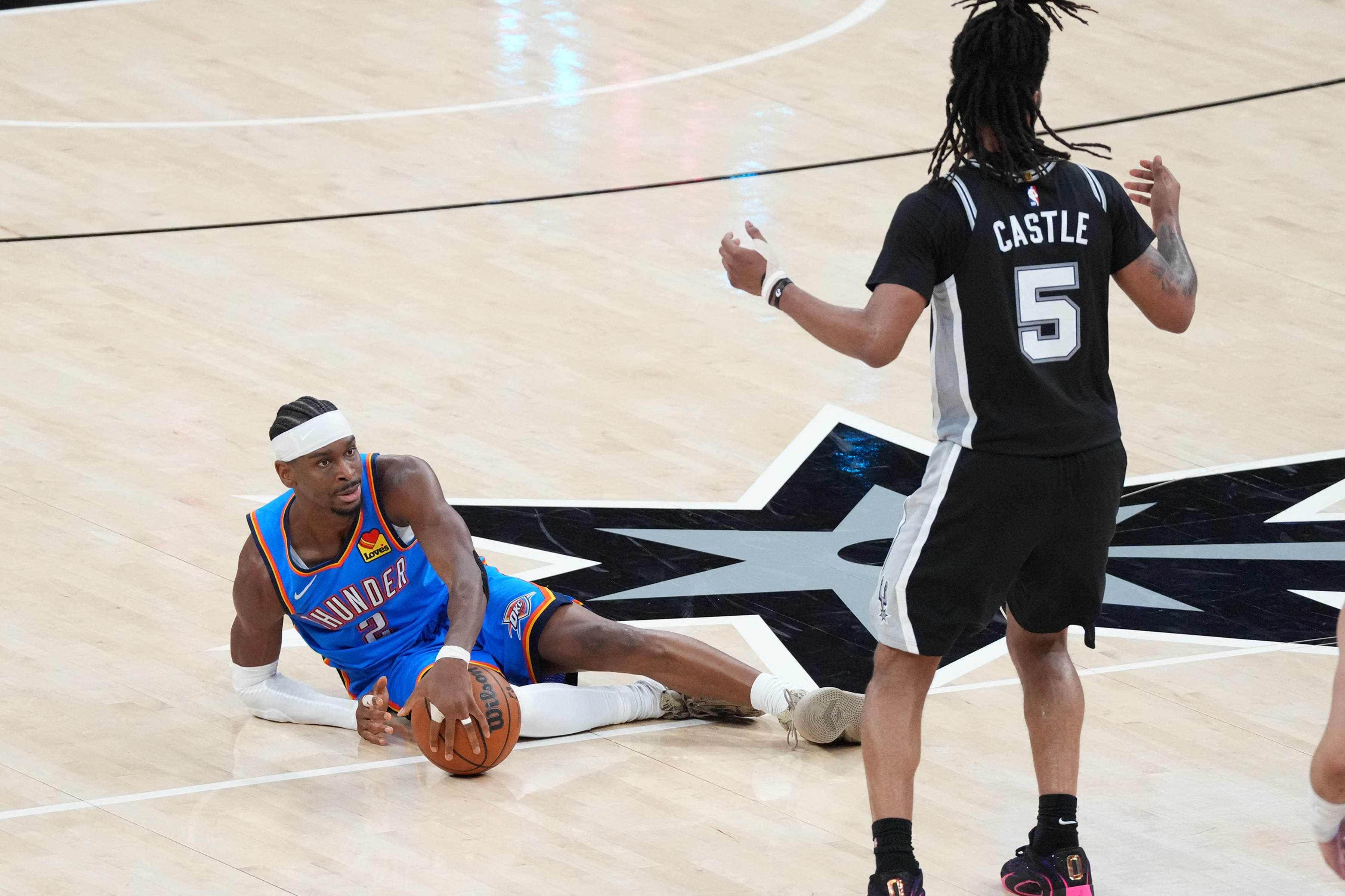 Oklahoma City Thunder guard Shai Gilgeous-Alexander is guarded by San Antonio Spurs guard Stephon Castle as we make our best Thunder vs. Spurs player props.