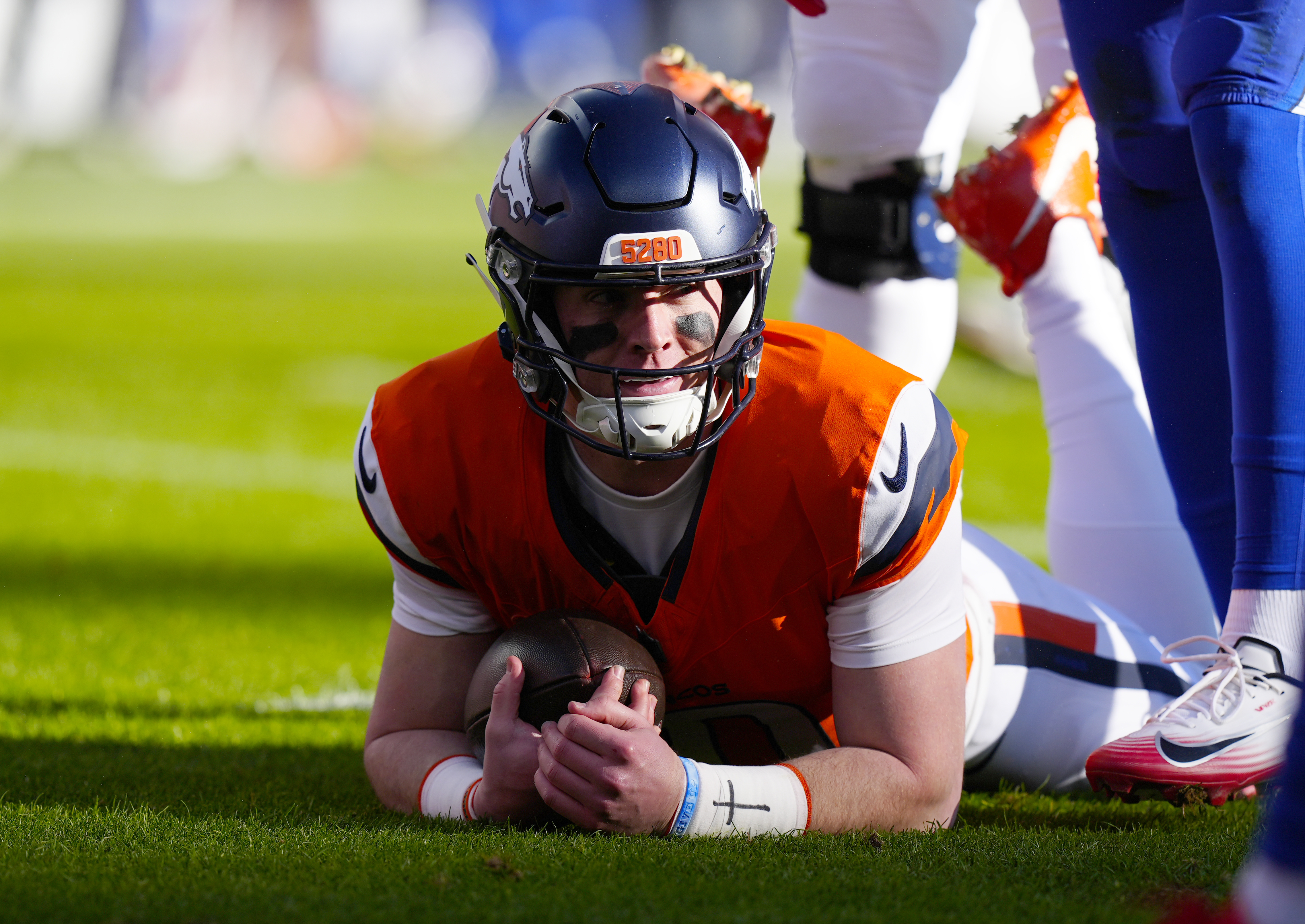 Denver Broncos quarterback Bo Nix (10) reacts after a play during the first quarter of an AFC Divisional Round playoff game against the Buffalo Bills at Empower Field at Mile High.