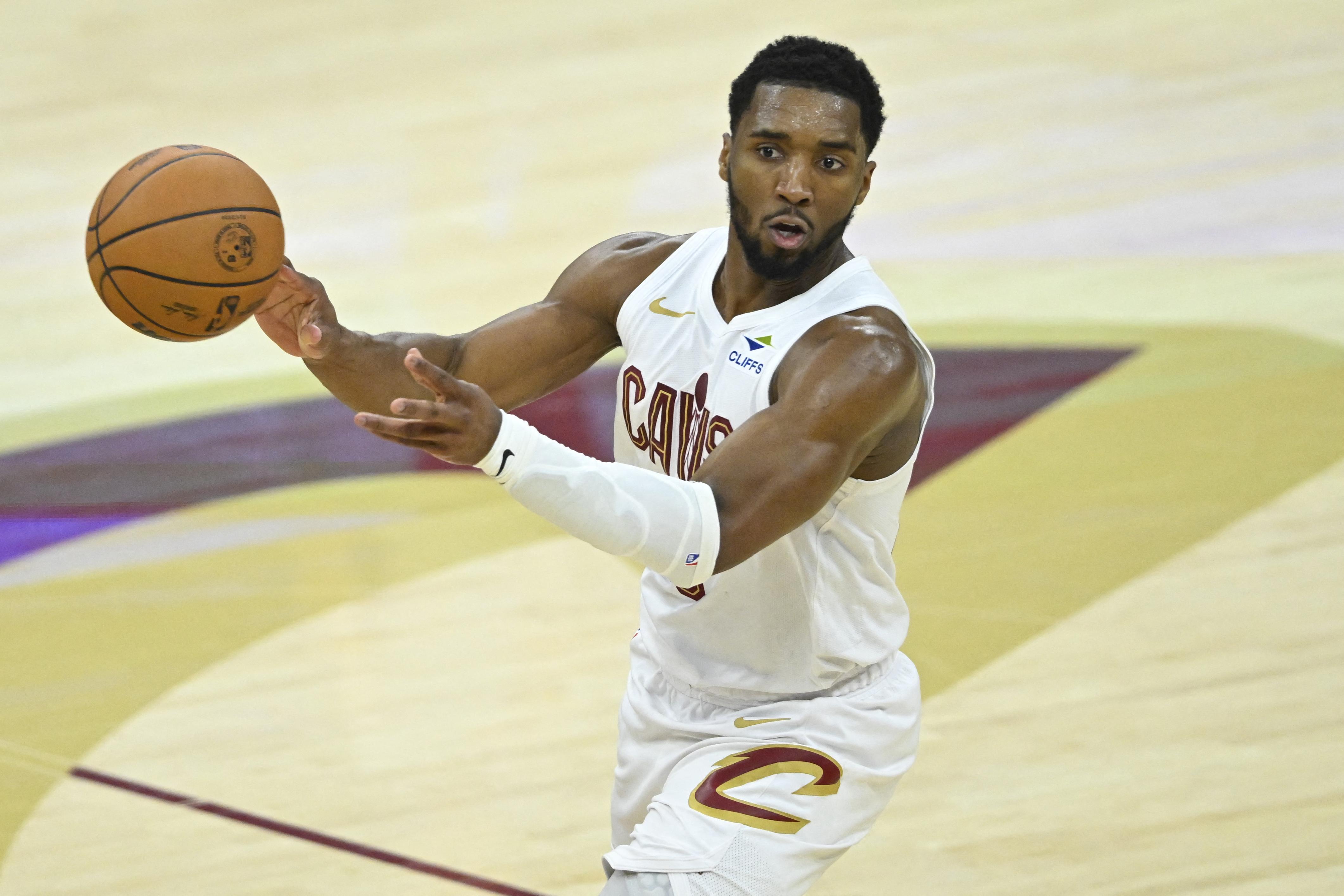 Cleveland Cavaliers guard Donovan Mitchell (45) throws a no-look pass as we break down our NBA Play of the Day.