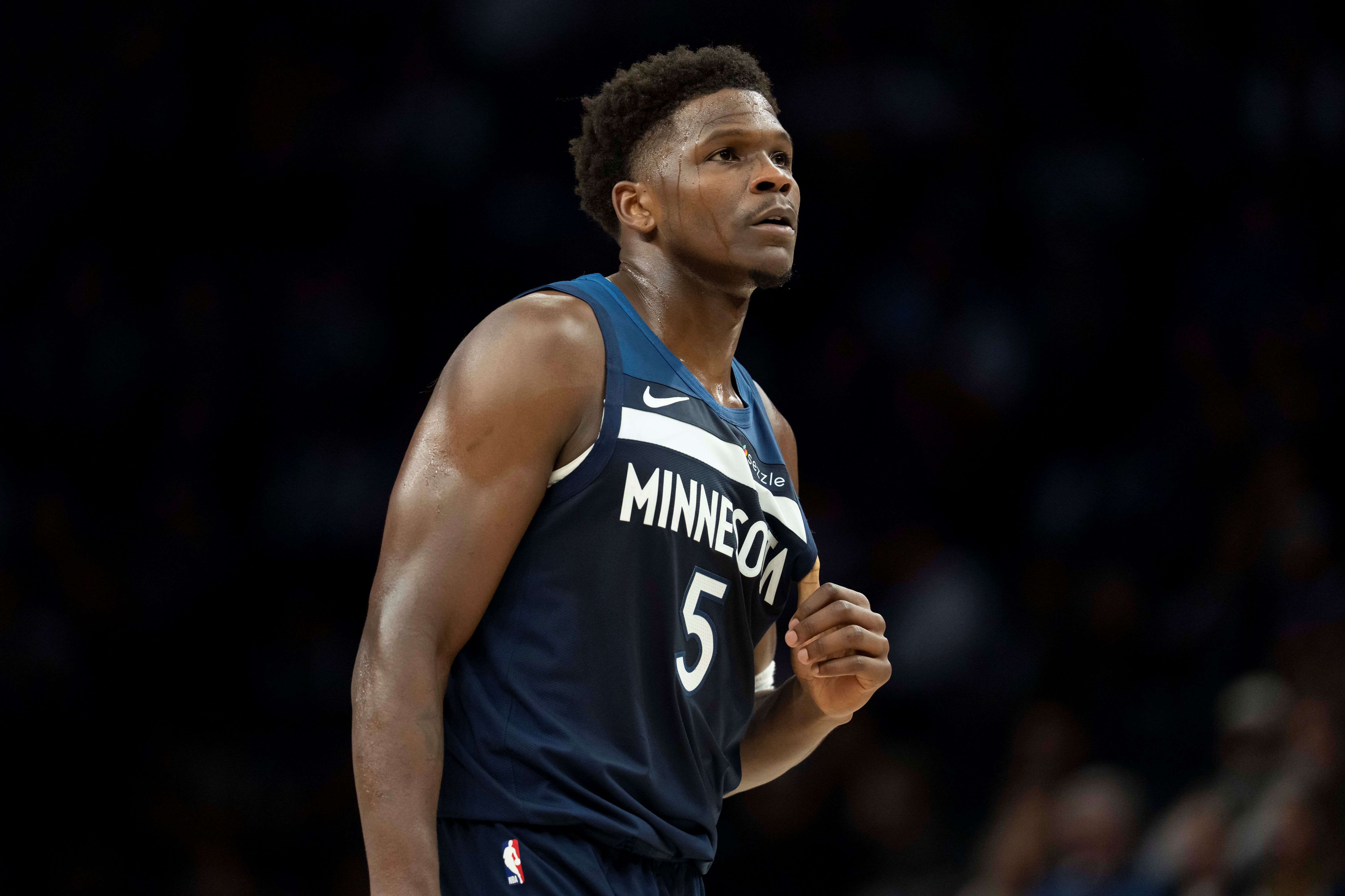 Minnesota Timberwolves guard Anthony Edwards (5) looks on as we dive into our Anthony Edwards injury update.