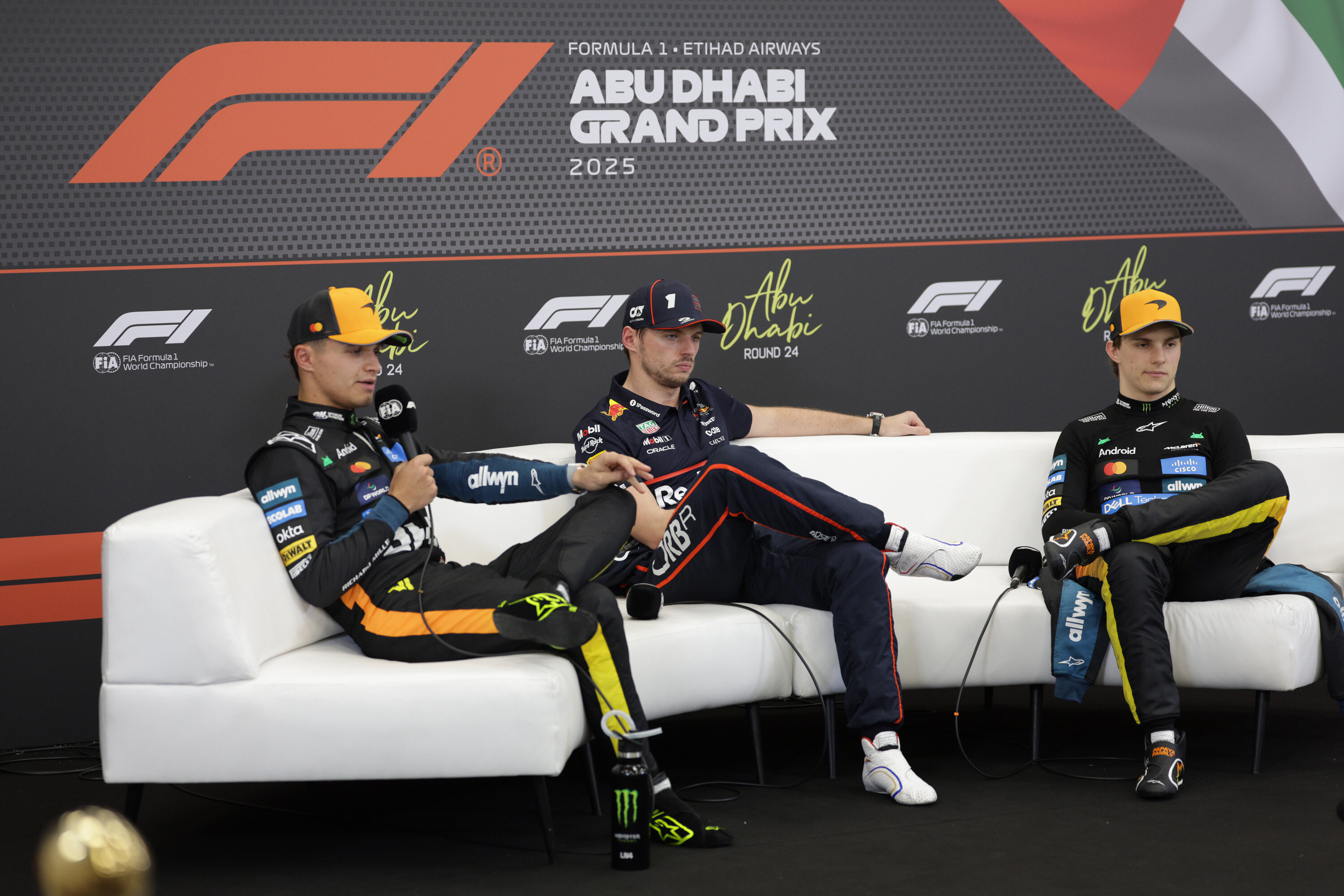 Lando Norris, Max Verstappen, and Oscar Piastri conducting an interview as we offer our Abu Dhabi Grand Prix best bets.