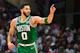 Jayson Tatum #0 of the Boston Celtics reacts after scoring a basket as we look at the NBA championship odds