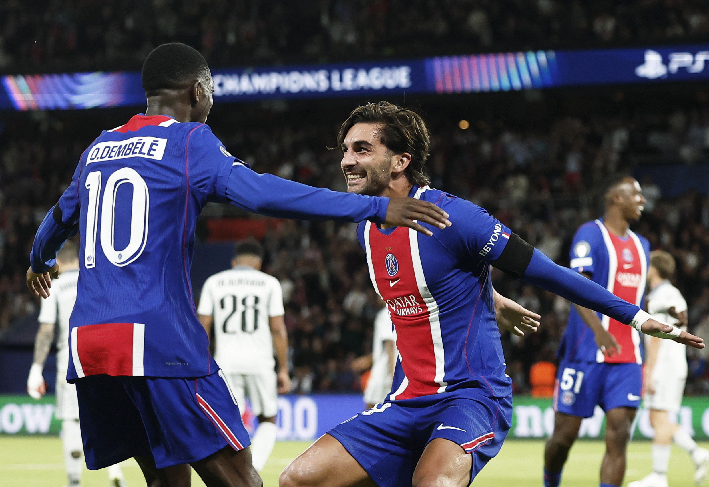 Paris Saint-Germain's Ferran Torres celebrates scoring with Ousmane Dembele as we make our best Manchester City vs. PSG prediction.