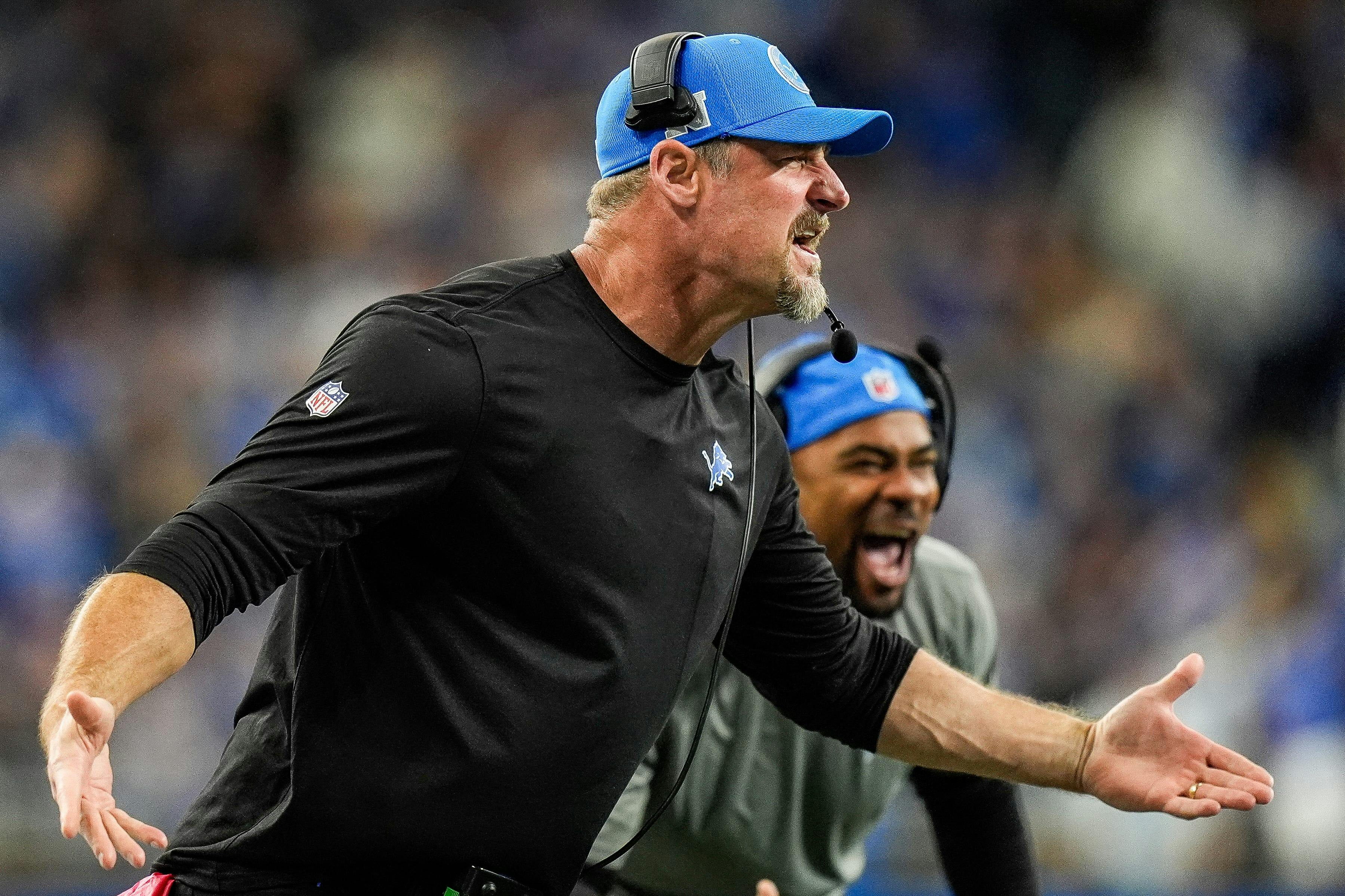 Detroit Lions head coach Dan Campbell celebrates a play against the Tennessee Titans, and he