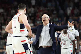 Head coach Dan Hurley and Alex Karaban #11 of the Connecticut Huskies celebrate as we look at the 2025 March Madness odds