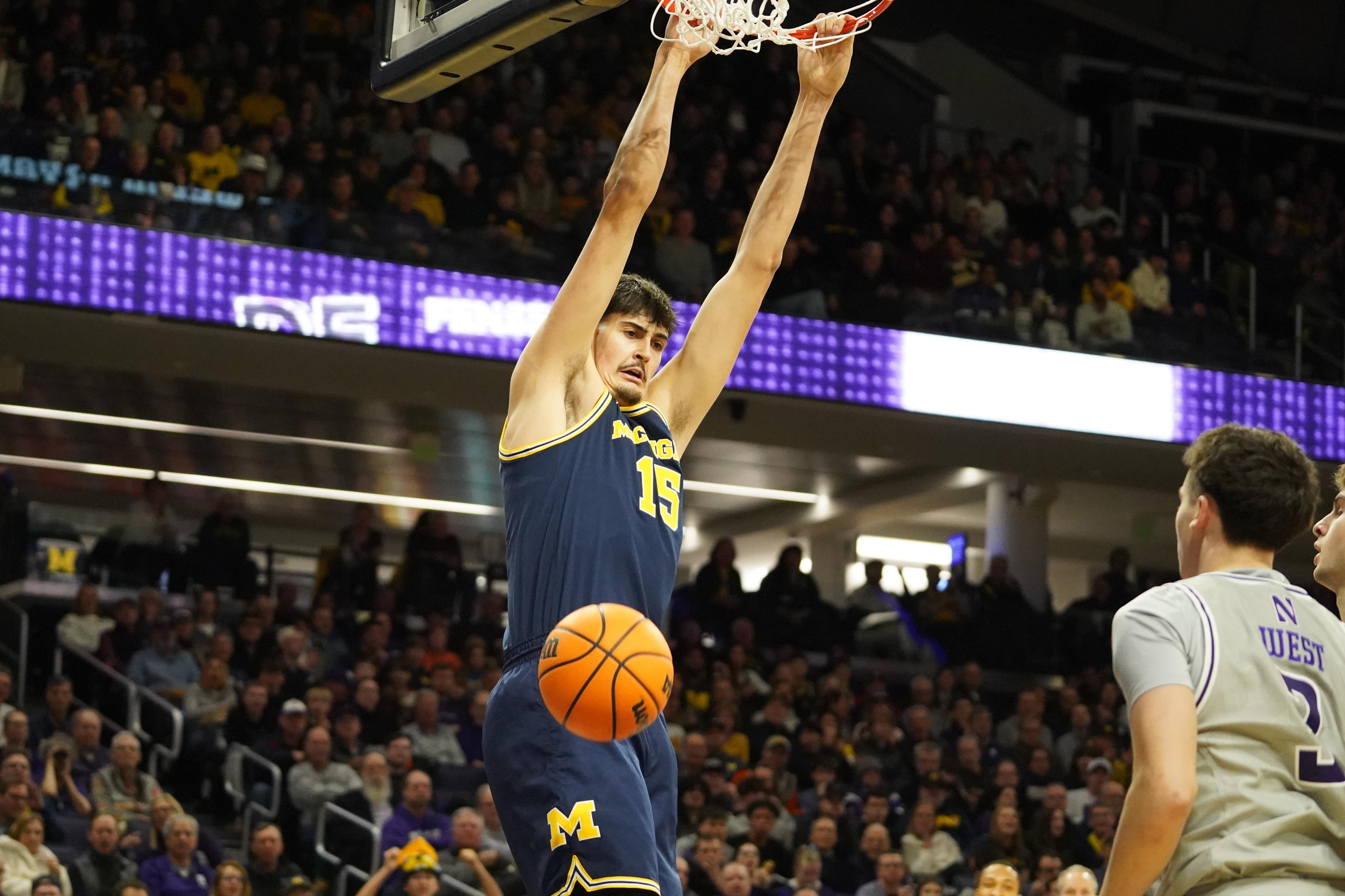 Michigan Wolverines center Aday Mara (15) dunks the ball as we break down our College Basketball Play of the Day.