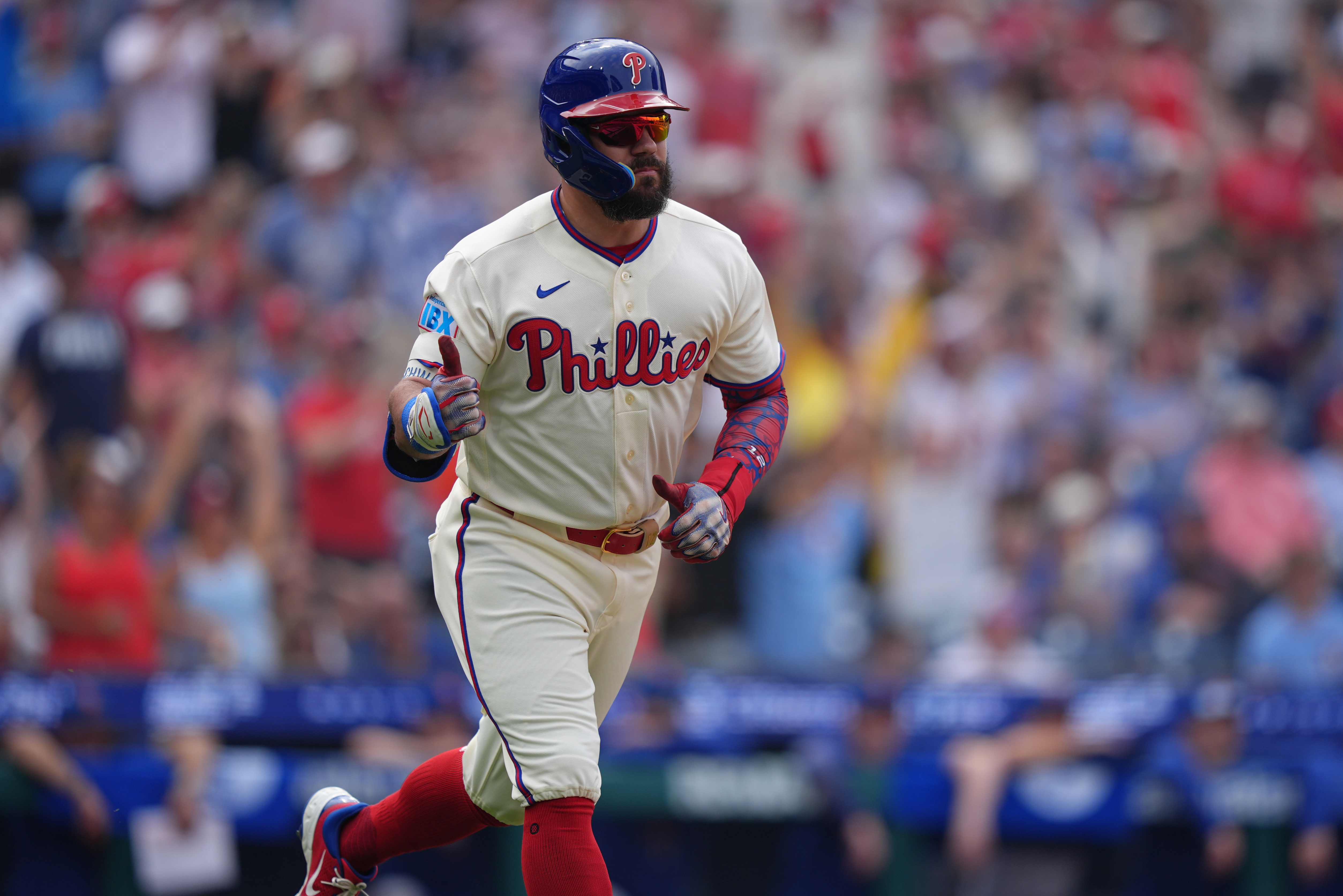 Philadelphia Phillies designated hitter Kyle Schwarber (12) reacts as he is featured in our Yankees vs. Phillies win probability.
