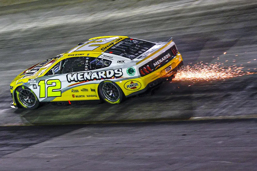 Ryan Blaney, driver of the #12 Menards/Pennzoil Ford, drives with sparks after an on-track incident during the NASCAR Cup Series Bass Pro Shops Night Race at Bristol Motor Speedway on Sept. 17.