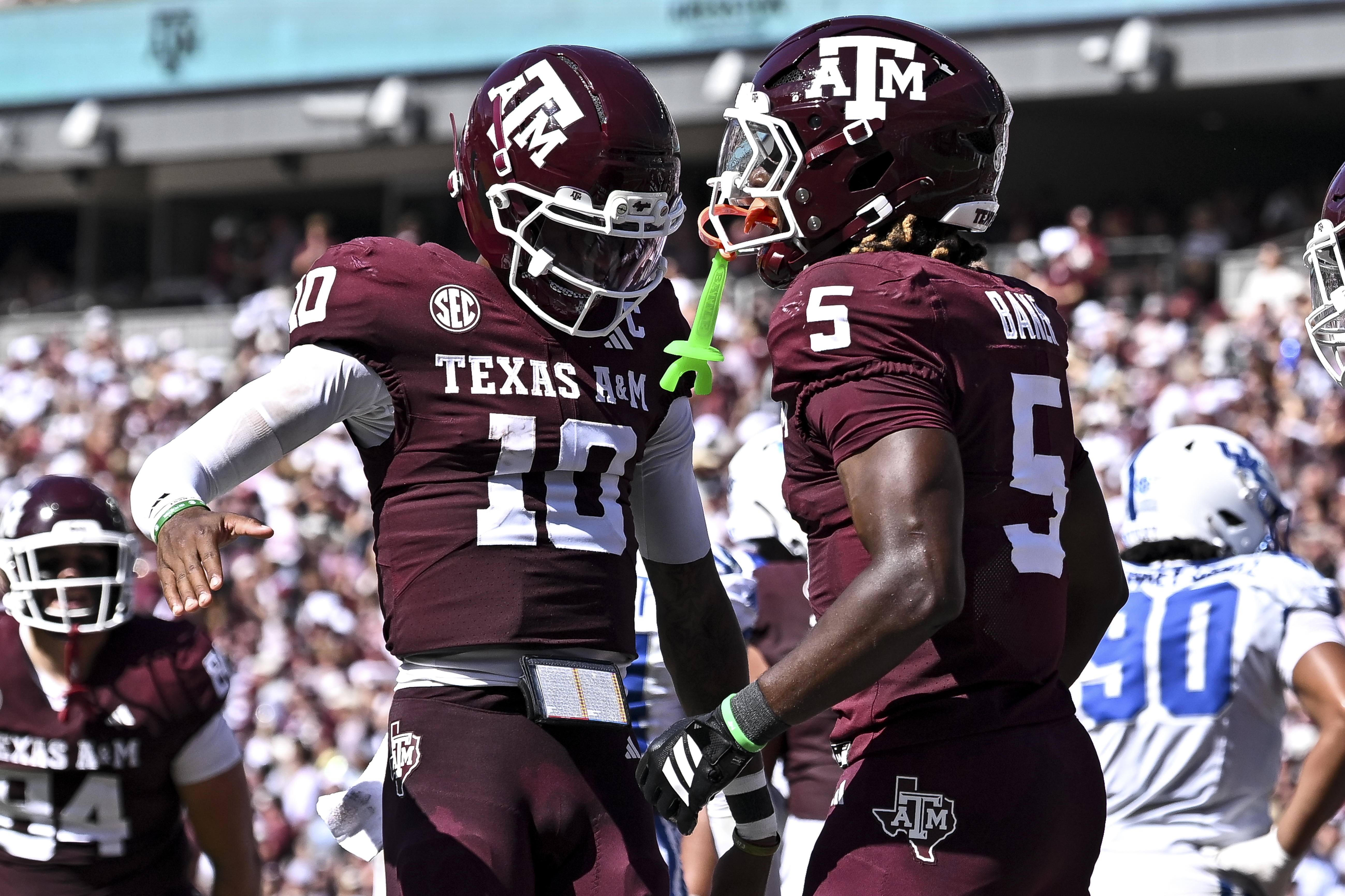 Texas A&M Aggies RB Carsyn Baker celebrates with QB Marcel Reed as we make our early Texas A&M vs. LSU prediction