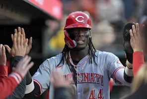 Elly De La Cruz of the Cincinnati Reds is congratulated by teammates after scoring against the San Francisco Giants, and we offer our top MLB player props and expert picks based on the best MLB odds.