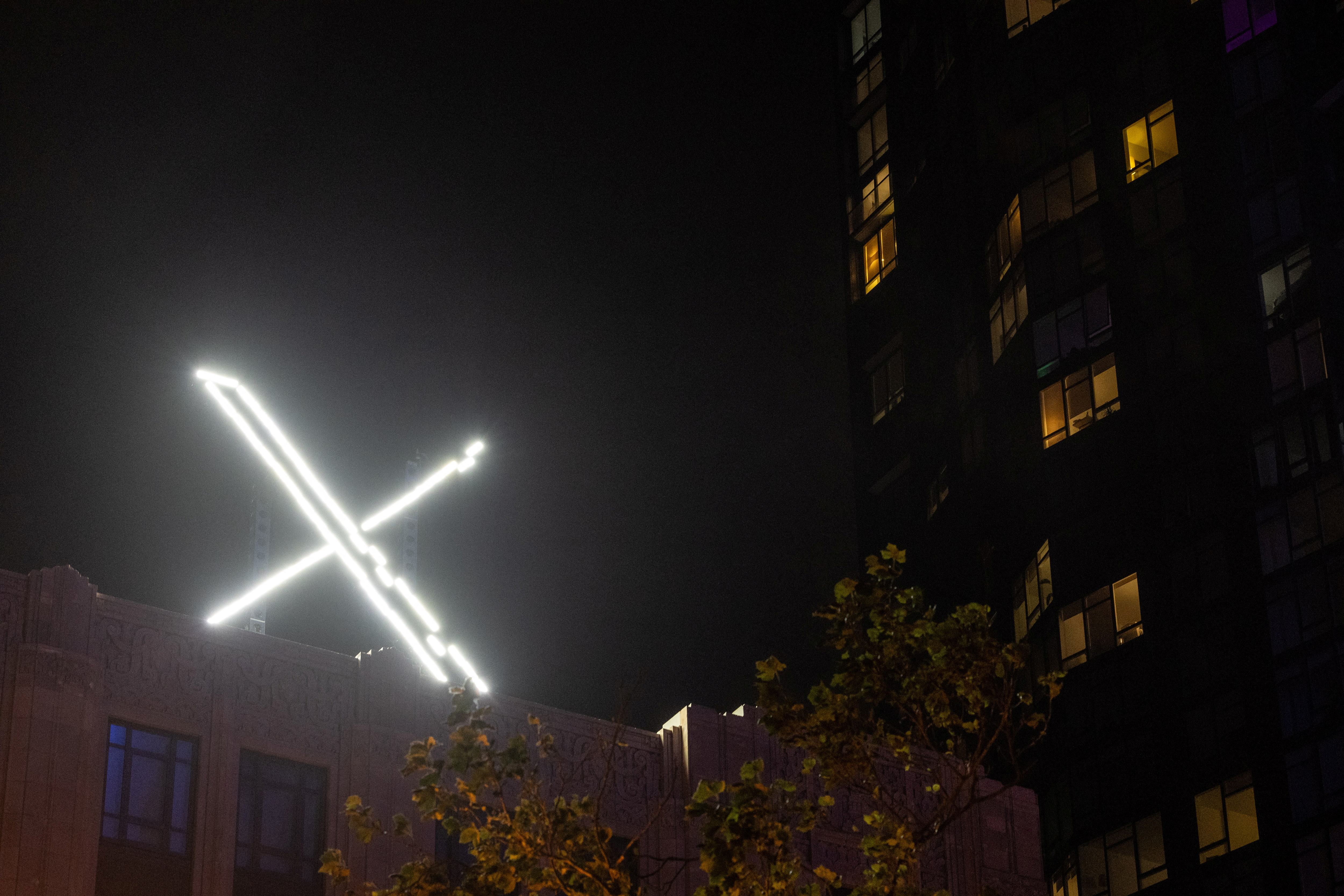 'X' logo is seen on the top of the headquarters as we look at Kalshi removing affiliation badges on the platform.