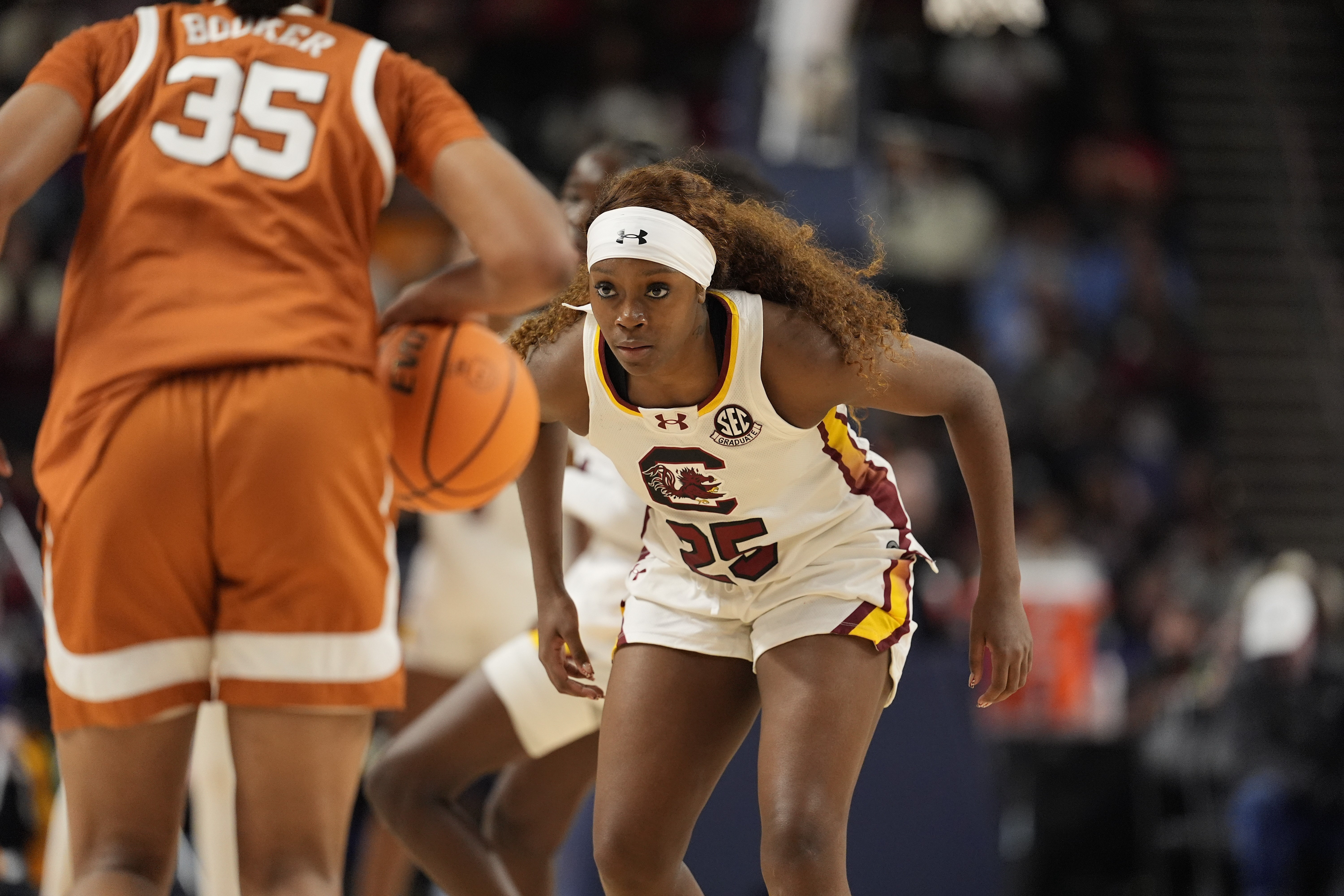 Texas' Madison Booker (35) and South Carolina's Raven Johnson (25) lead teams that are among the programs focused on in our women’s March Madness predictions for the Final Four.