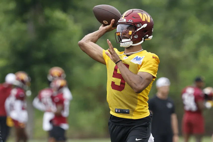 Washington Commanders quarterback Jayden Daniels passes a ball during an OTA workout at Commanders Park as we look at multiple sportsbooks now being active in Washington D.C.