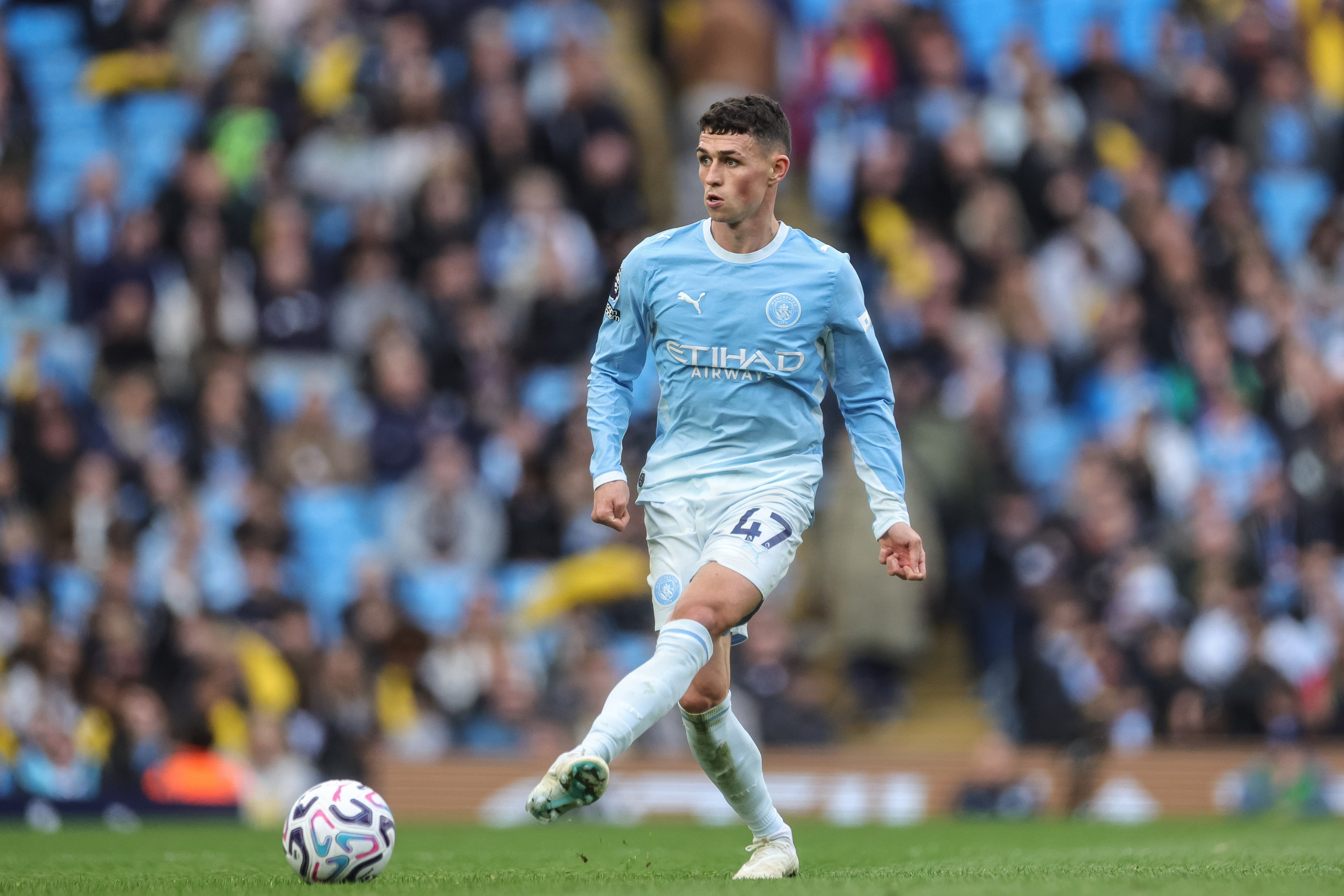 Phil Foden of Manchester City with the ball as we make our best Manchester City vs. AEK Athens prediction.
