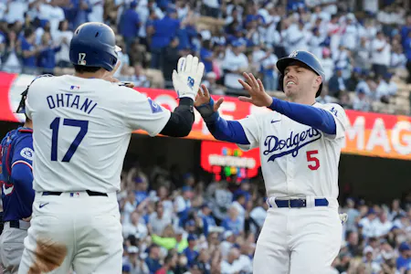 Los Angeles Dodgers first baseman Freddie Freeman celebrates with designated hitter Shohei Ohtani after scoring in the first inning against the Texas Rangers at Dodger Stadium as we look at our World Series odds.