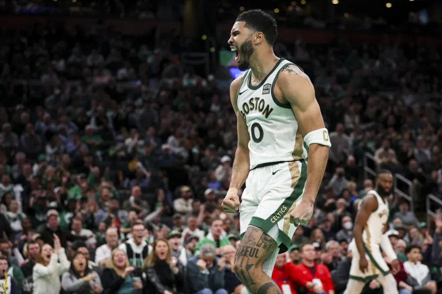 Jayson Tatum #0 of the Boston Celtics reacts after a dunk as we look at our top Mavericks vs. Celtics NBA player props for Friday