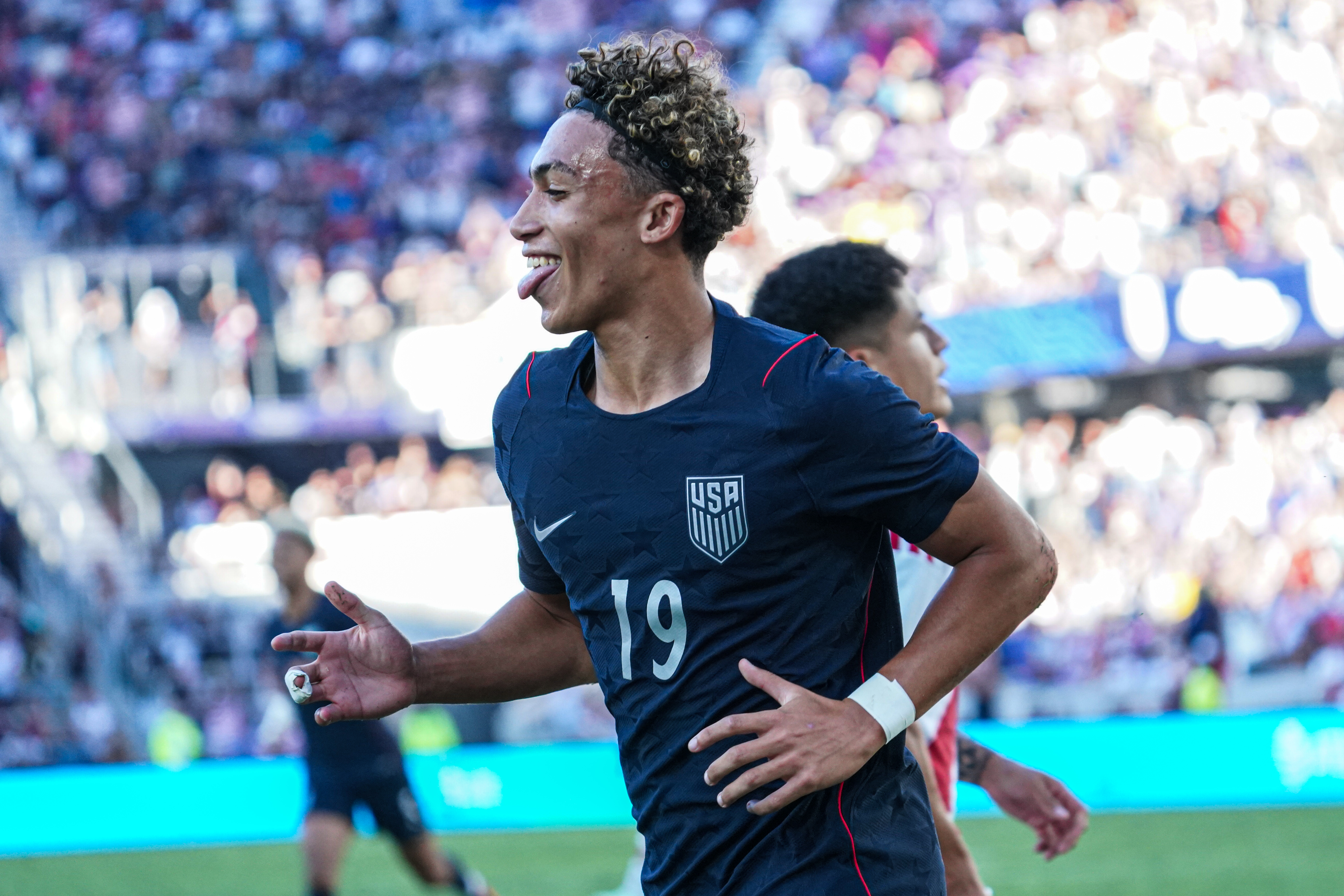 Julian Hall celebrates a goal as we make our best USA vs. Canada predictions.
