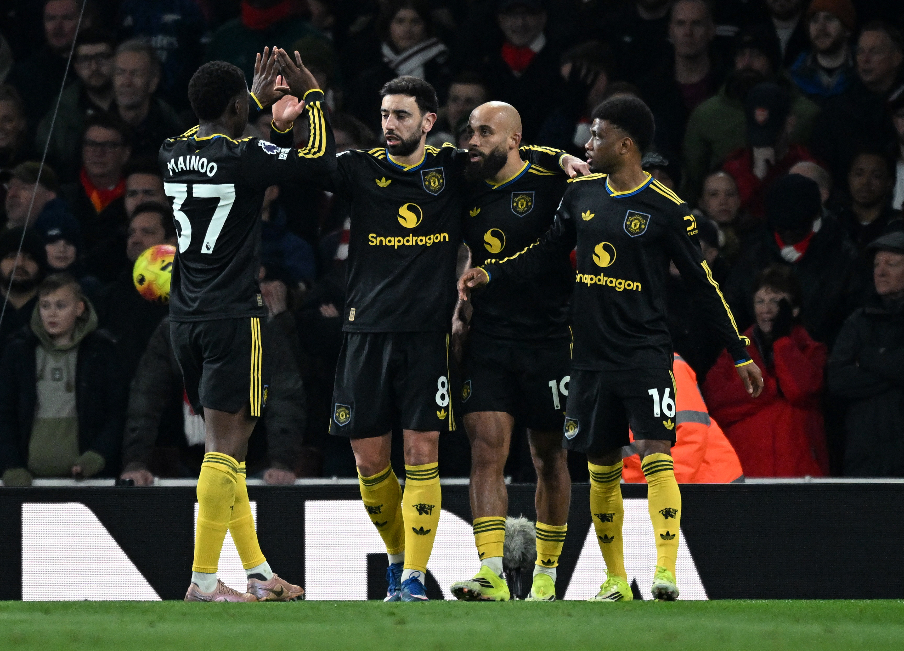 Pictured: Red Devils players celebrating as we break down our Fulham vs. Manchester United Prediction. Photo by REUTERS/Dylan Martinez.